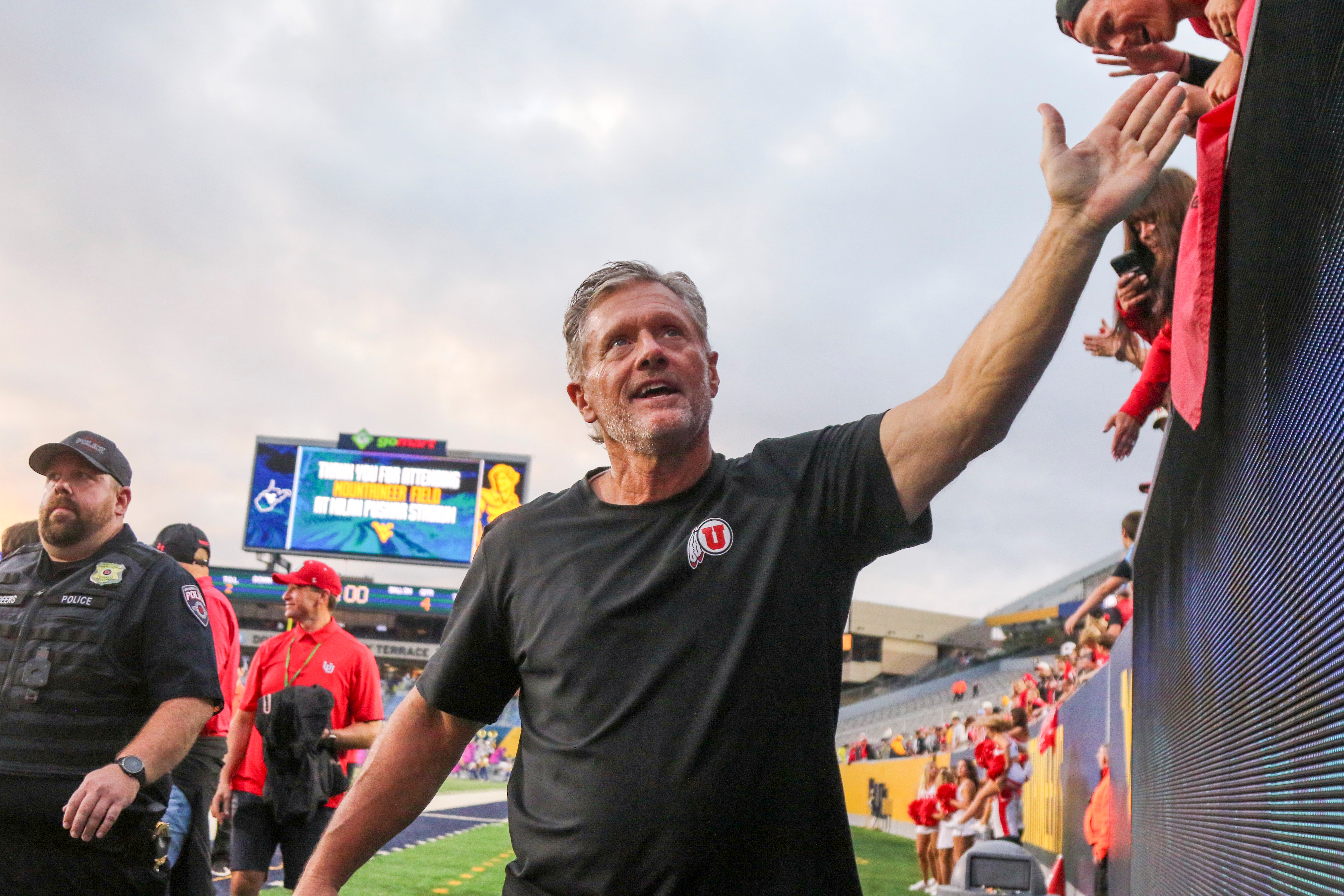 Sep 27, 2025; Morgantown, West Virginia, USA; Utah Utes head coach Kyle Whittingham celebrates with fans after defeating the West Virginia Mountaineers at Milan Puskar Stadium.