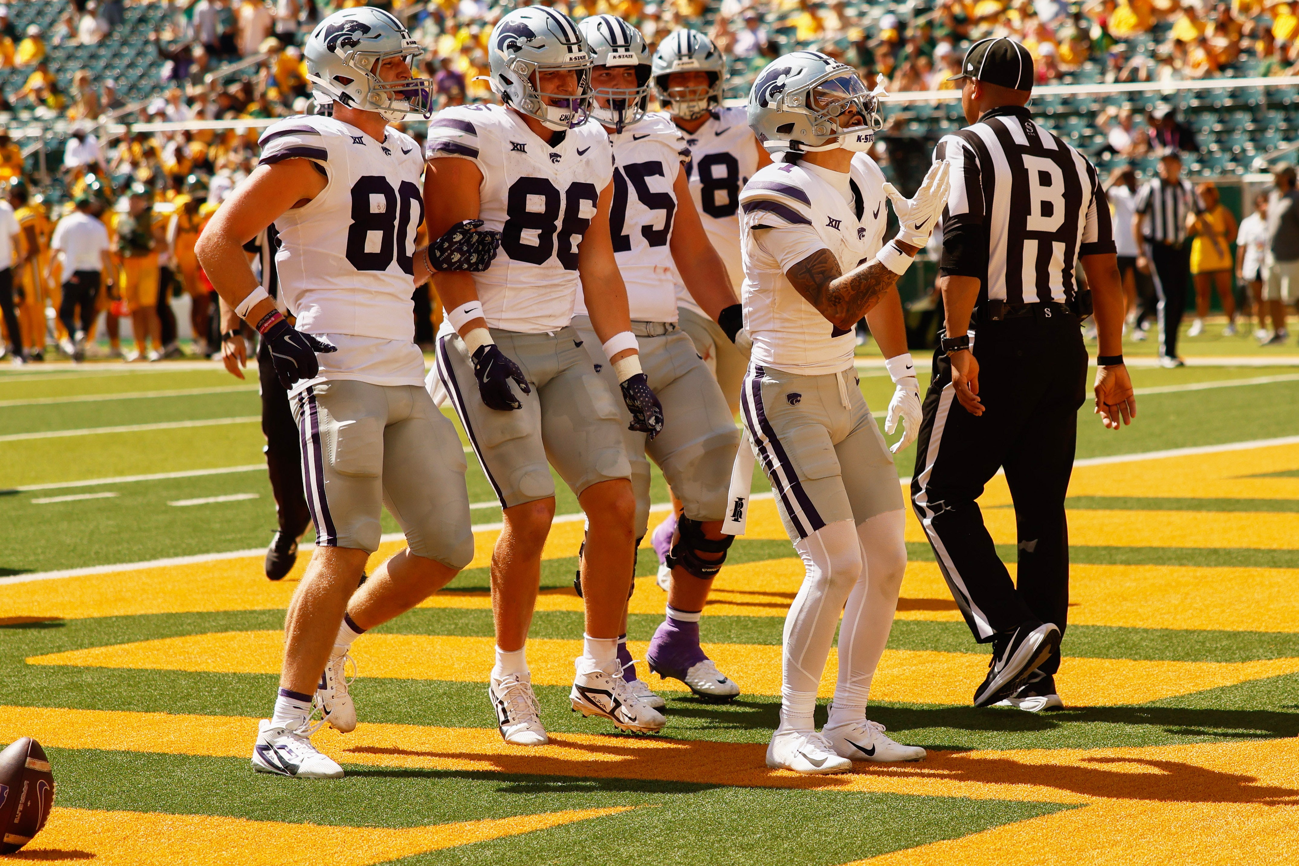 Oct 4, 2025; Waco, Texas, USA; Kansas State Wildcats wide receiver Jayce Brown (1) celebrates with tight ends Will Anciaux (80) and Garrett Oakley (86), and offensive linemen Sam Hecht (75) and John Pastore (78) after scoring a touchdown against the Baylor Bears during the second half at McLane Stadium. Mandatory Credit: Chris Jones-Imagn Images