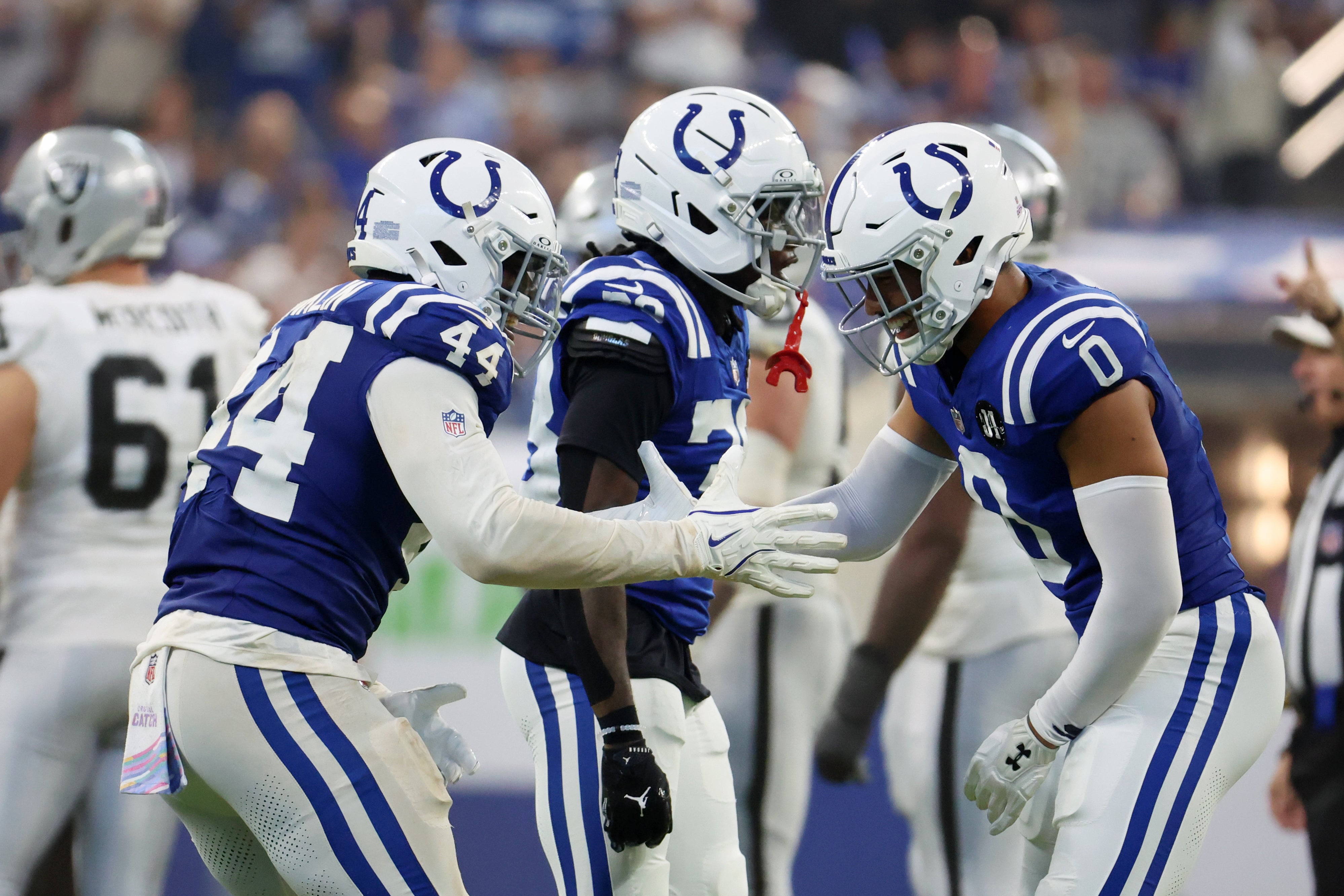 Colts defense celebrates a play