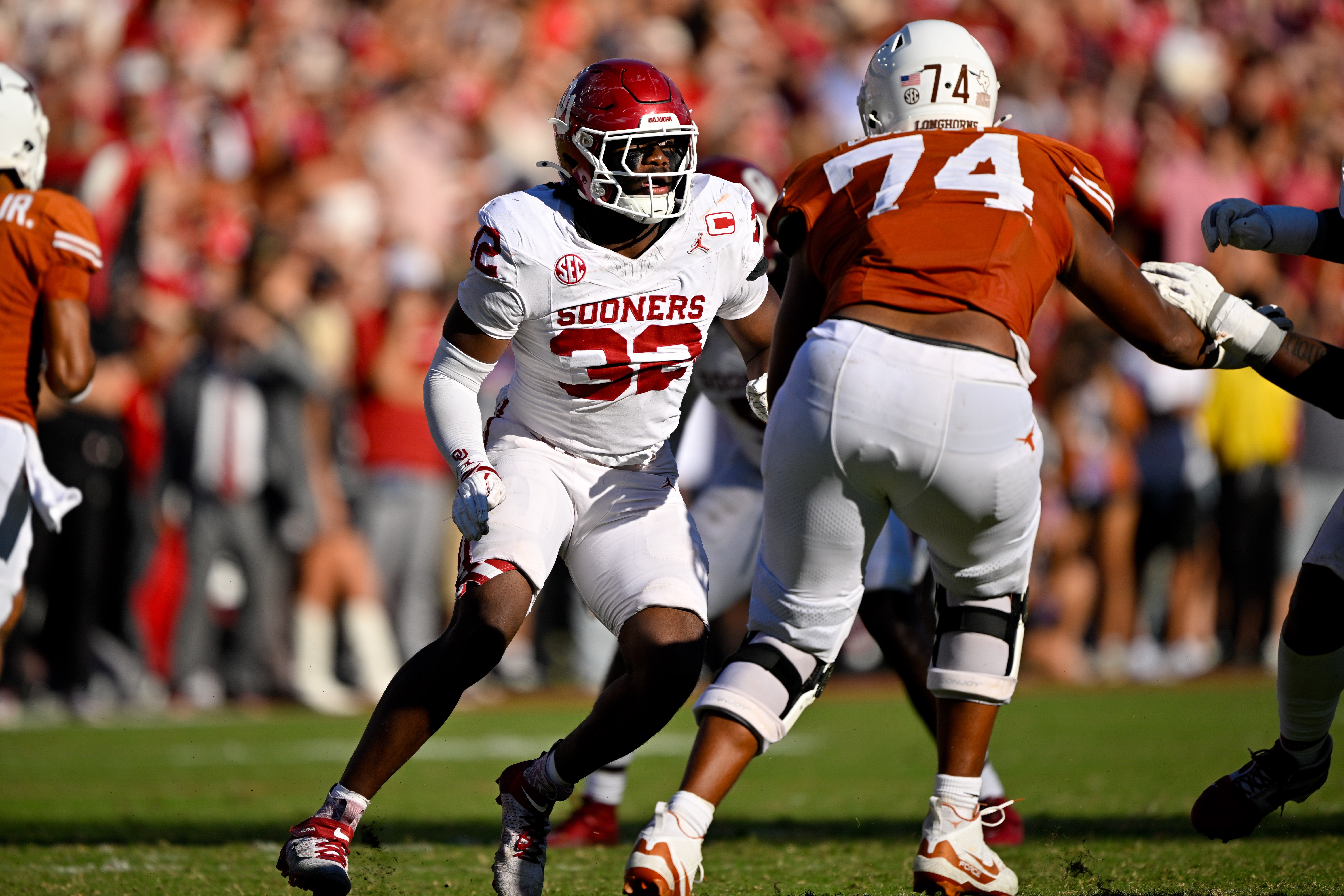 Oct 11, 2025; Dallas, Texas, USA; Texas Longhorns offensive lineman Trevor Goosby (74) blocks Oklahoma Sooners defensive lineman R Mason Thomas (32) during the game between the Texas Longhorns and the Oklahoma Sooners at the Cotton Bowl. Mandatory Credit: Jerome Miron-Imagn Images