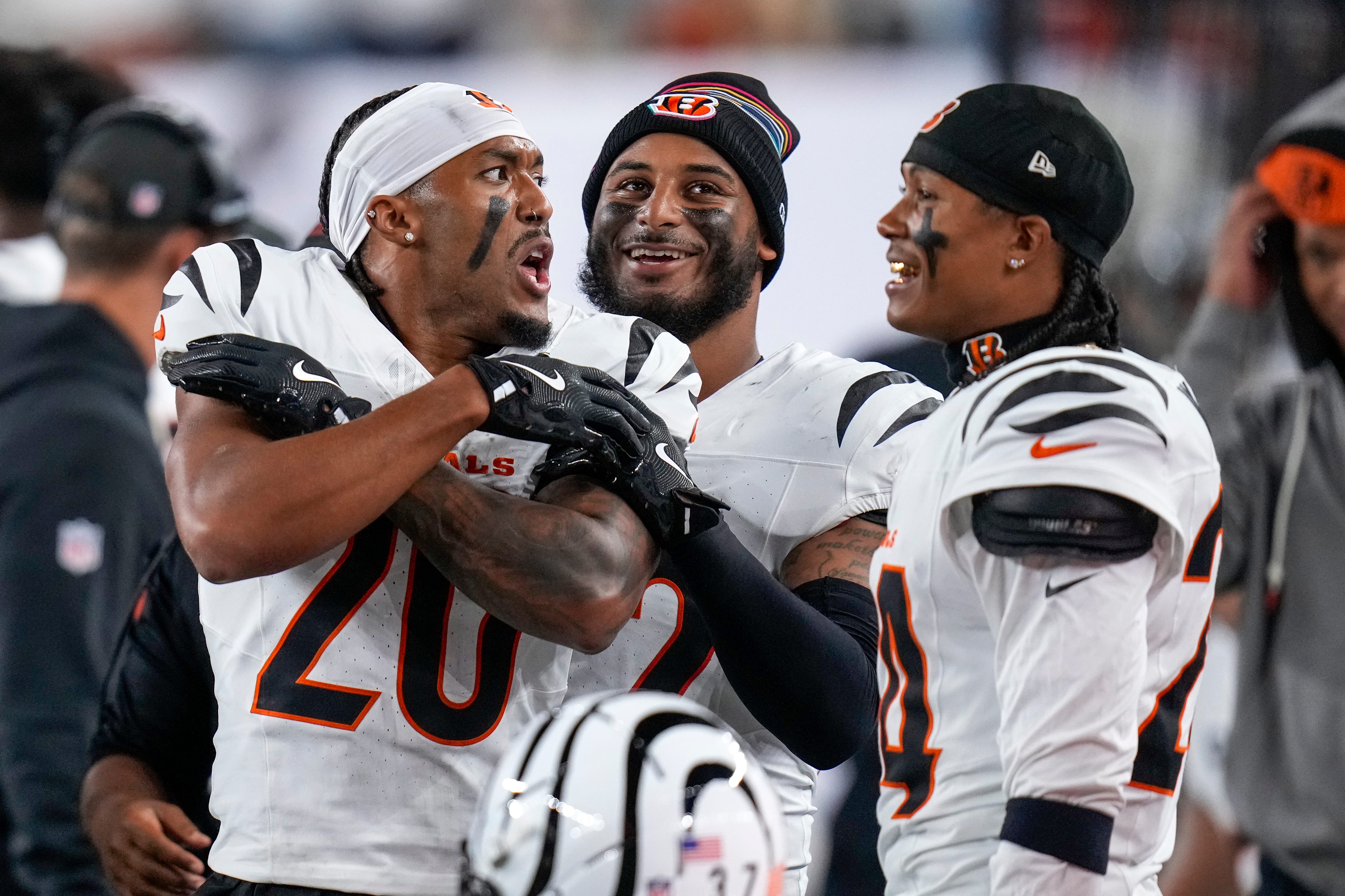 Cincinnati Bengals cornerback DJ Turner II (20) celebrates an interception on the sideline in the second quarter of the NFL Week 7 game between the Cincinnati Bengals and the Pittsburgh Steelers at Paycor Stadium in downtown Cincinnati on Thursday, Oct. 16, 2025.