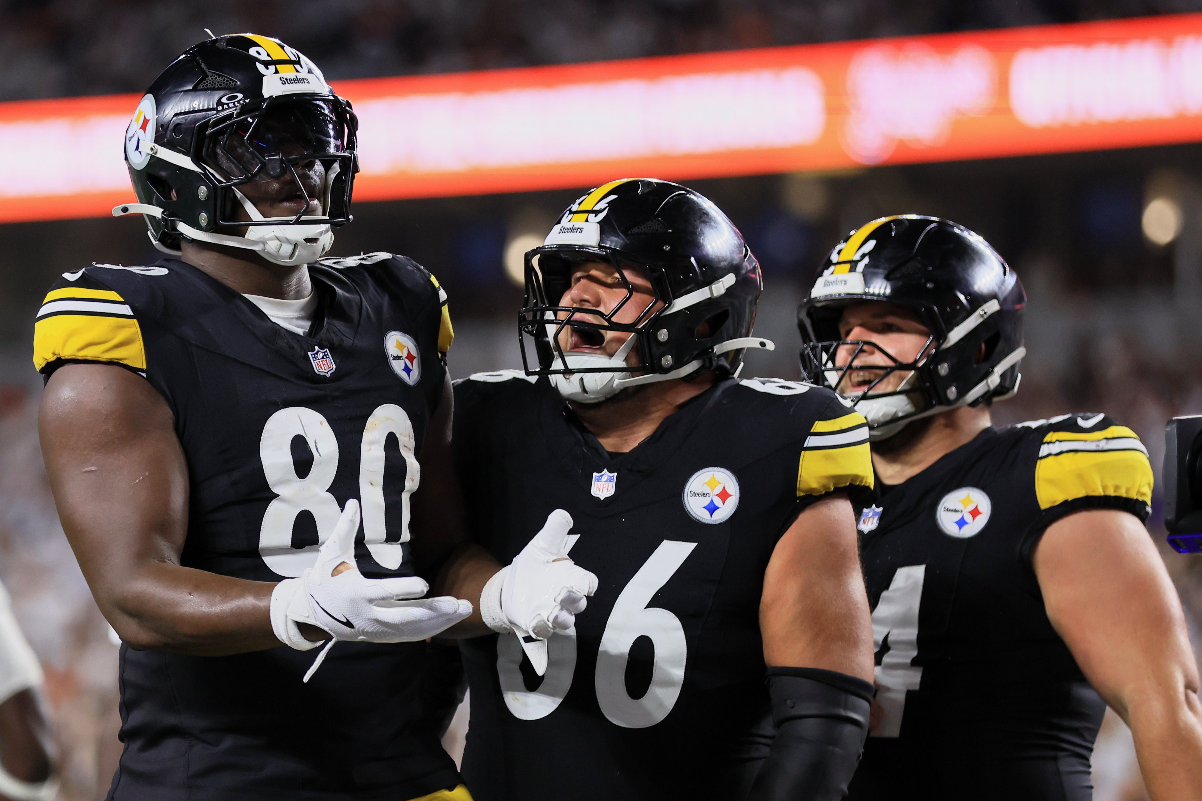 Oct 16, 2025; Cincinnati, Ohio, USA; Pittsburgh Steelers tight end Darnell Washington (80) celebrates with guard Mason McCormick (66) and center Zach Frazier (54) after scoring a touchdown against the Cincinnati Bengals during the fourth quarter at Paycor Stadium.