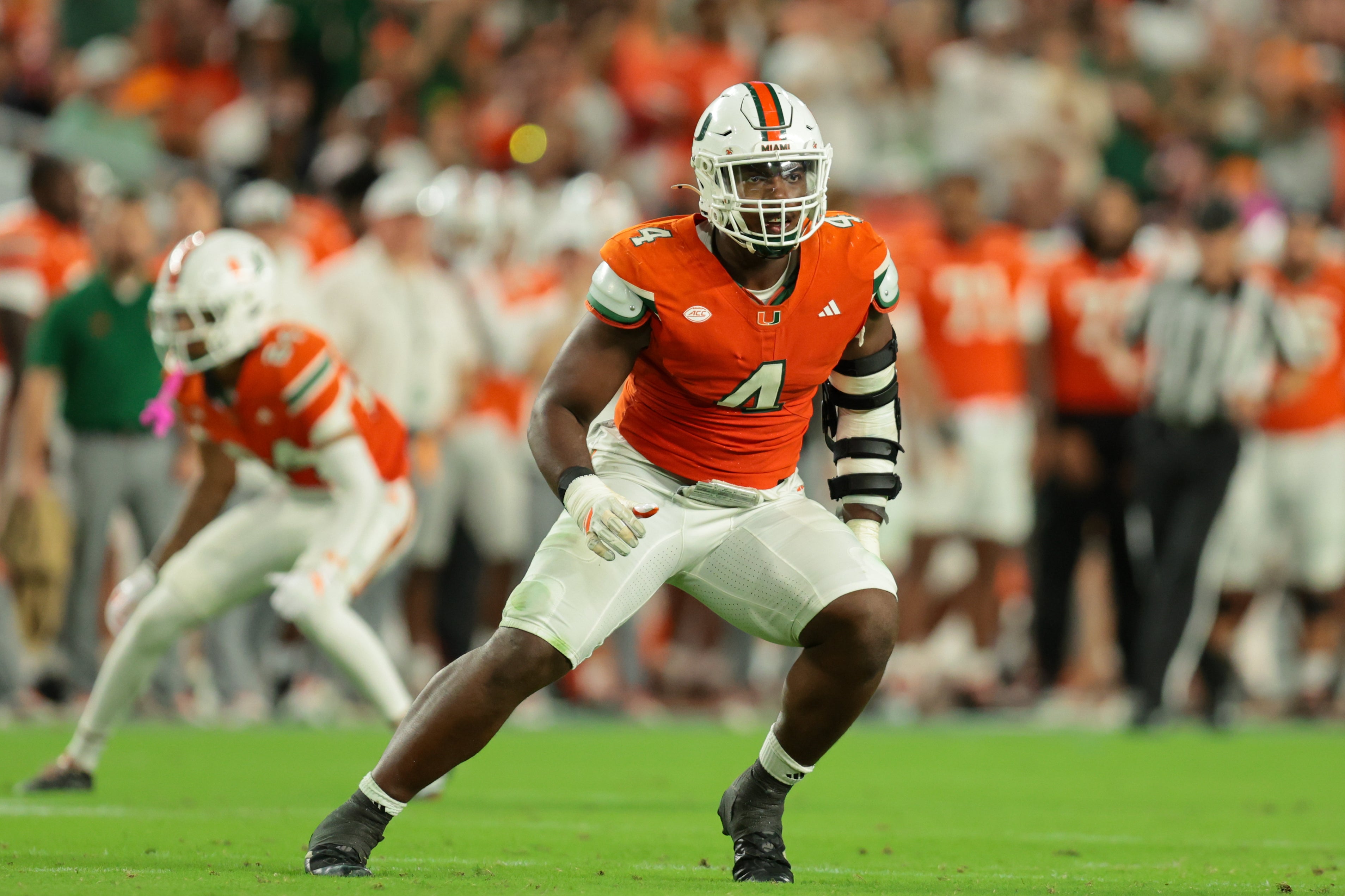 Oct 17, 2025; Miami Gardens, Florida, USA; Miami Hurricanes defensive lineman Rueben Bain Jr. (4) plays his position against the Louisville Cardinals during the third quarter at Hard Rock Stadium. Mandatory Credit: Sam Navarro-Imagn Images