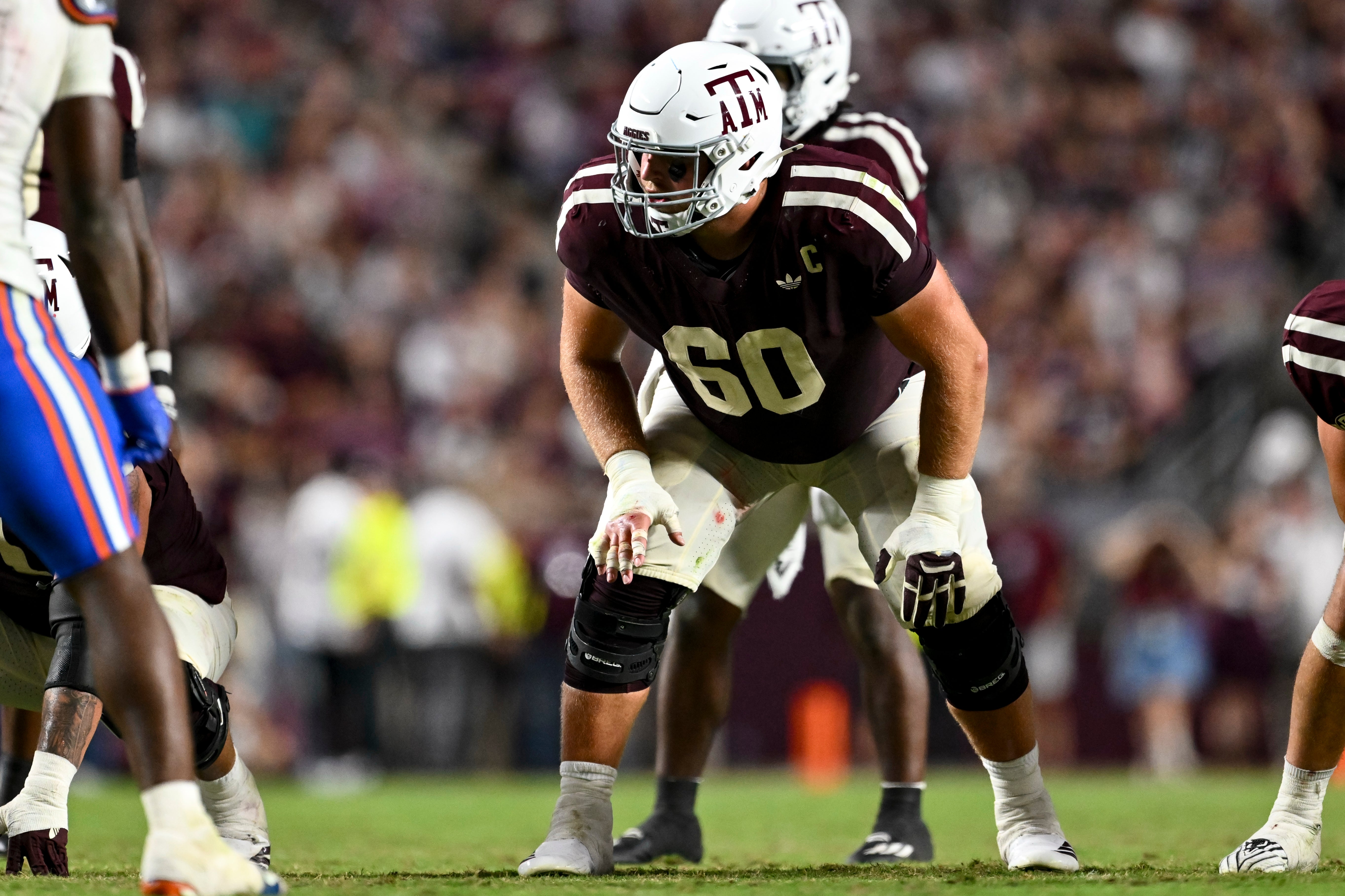 Oct 11, 2025; College Station, Texas, USA; Texas A&M Aggies offensive lineman Trey Zuhn III (60) lines up during the fourth quarter against the Florida Gators at Kyle Field.
