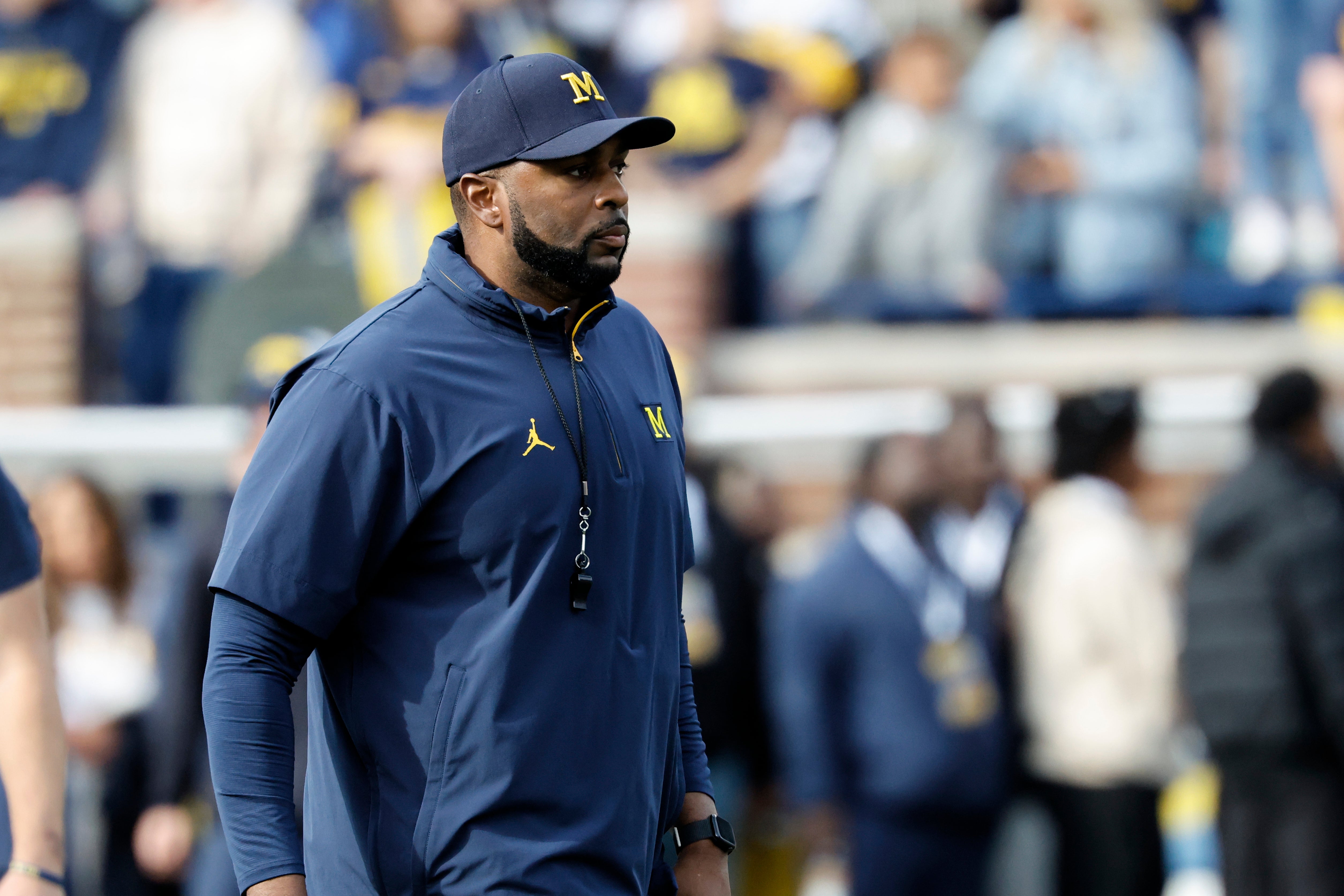 Oct 18, 2025; Ann Arbor, Michigan, USA; Michigan Wolverines head coach Sherrone Moore walks off the field before the game against the Washington Huskies at Michigan Stadium.