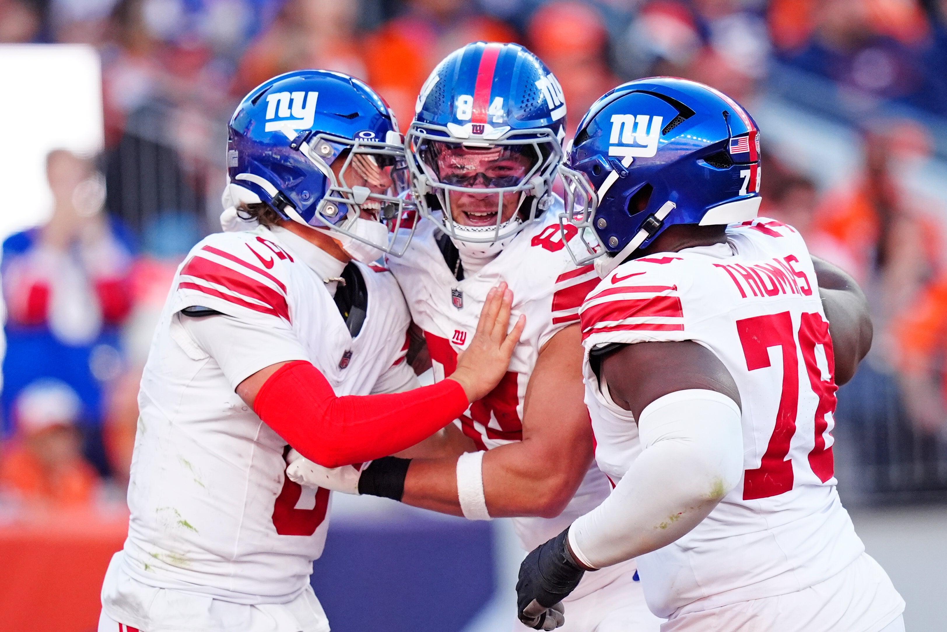Oct 19, 2025; Denver, Colorado, USA; New York Giants quarterback Jaxson Dart (6), New York Giants tight end Theo Johnson (84) and New York Giants offensive tackle Andrew Thomas (78) react after a play during the second half against the Denver Broncos at Empower Field at Mile High.