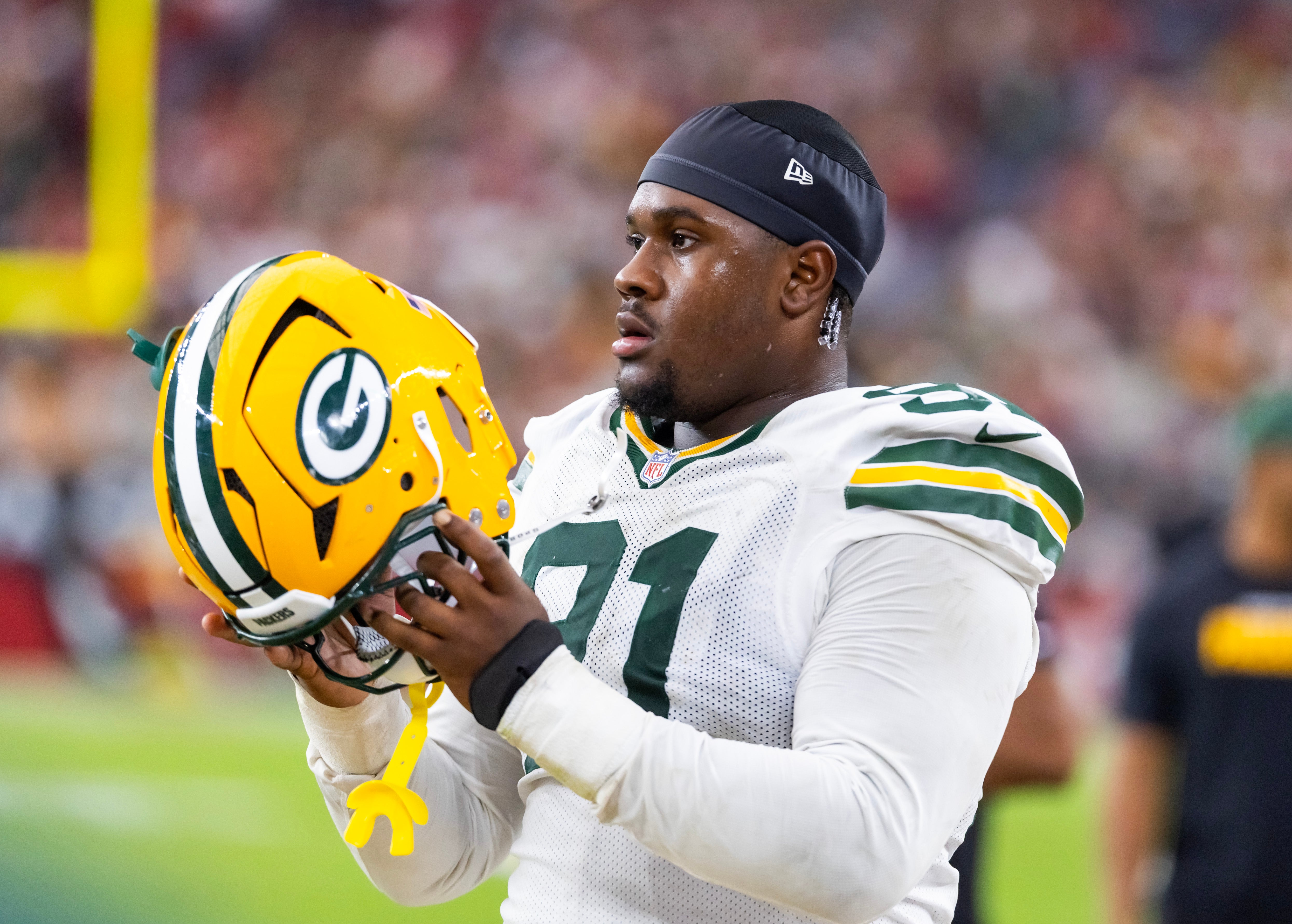 Oct 19, 2025; Glendale, Arizona, USA; Green Bay Packers defensive lineman Warren Brinson (91) against the Arizona Cardinals at State Farm Stadium.