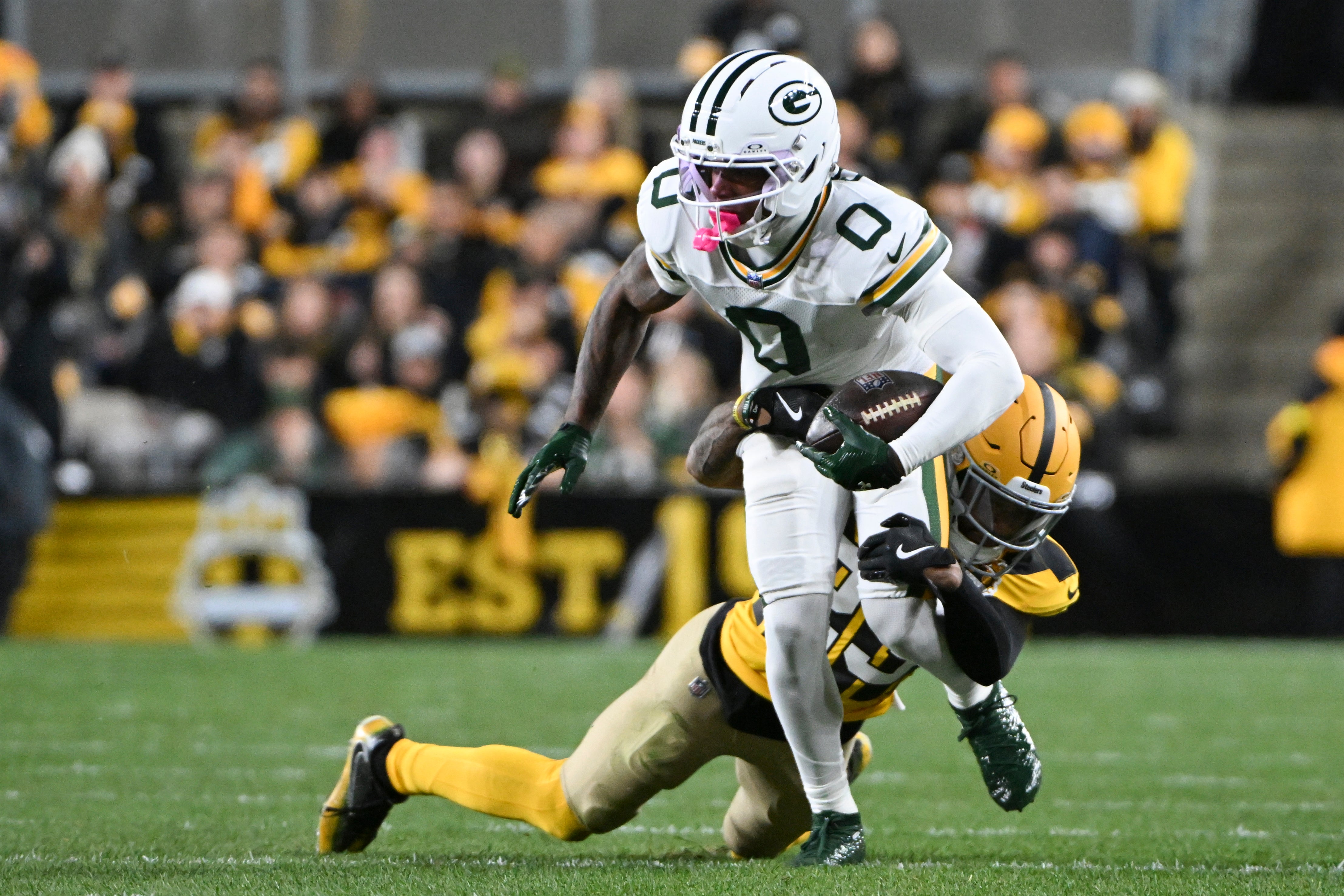 Oct 26, 2025; Pittsburgh, Pennsylvania, USA; Green Bay Packers wide receiver Matthew Golden is tackled by Pittsburgh Steelers cornerback Darius Slay (23) during the first quarter at Acrisure Stadium.