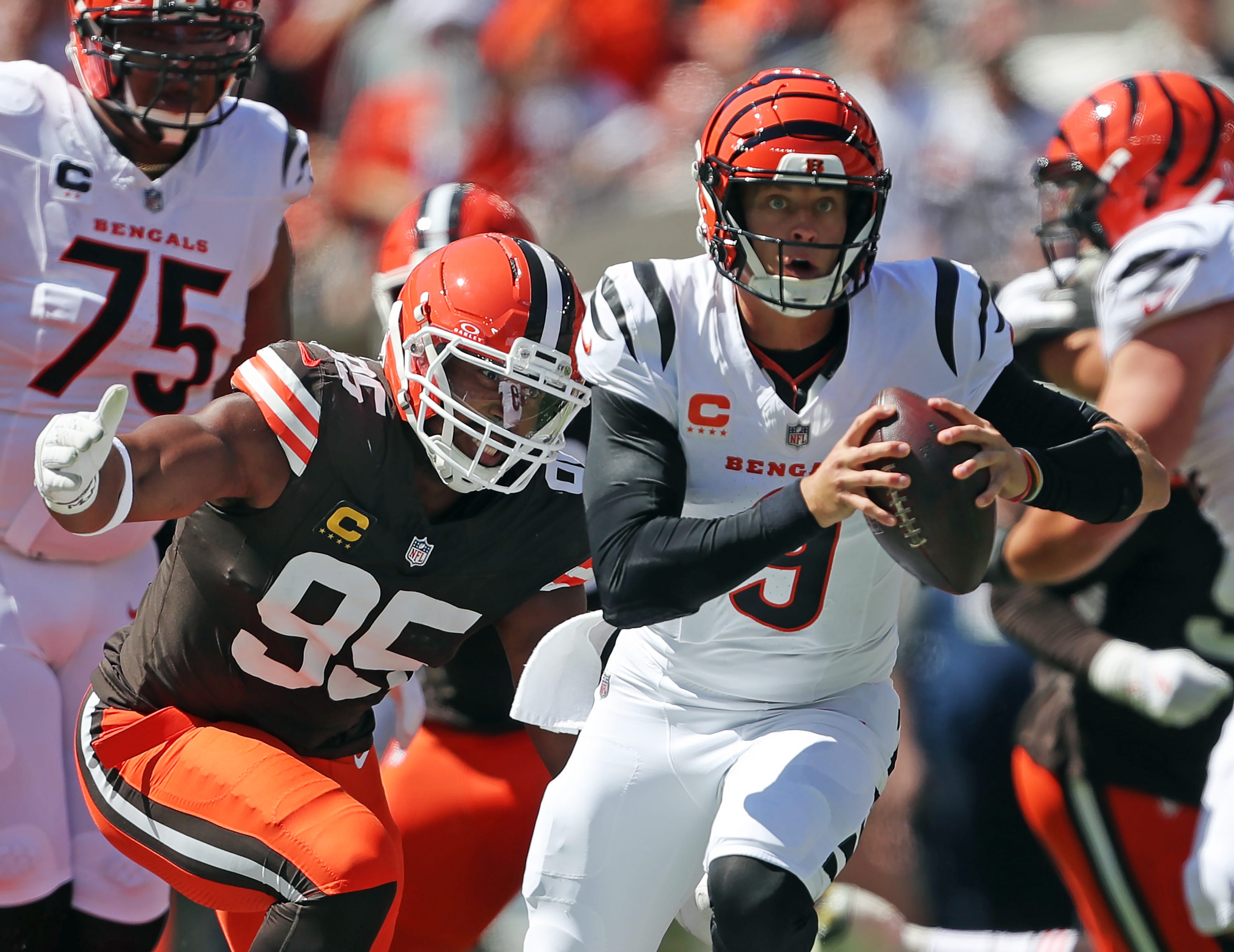 Cleveland Browns defensive end Myles Garrett (95) chases down Cincinnati Bengals quarterback Joe Burrow (9) during the first half of an NFL football game at Huntington Bank Field, Sept. 7, 2025, in Cleveland, Ohio.