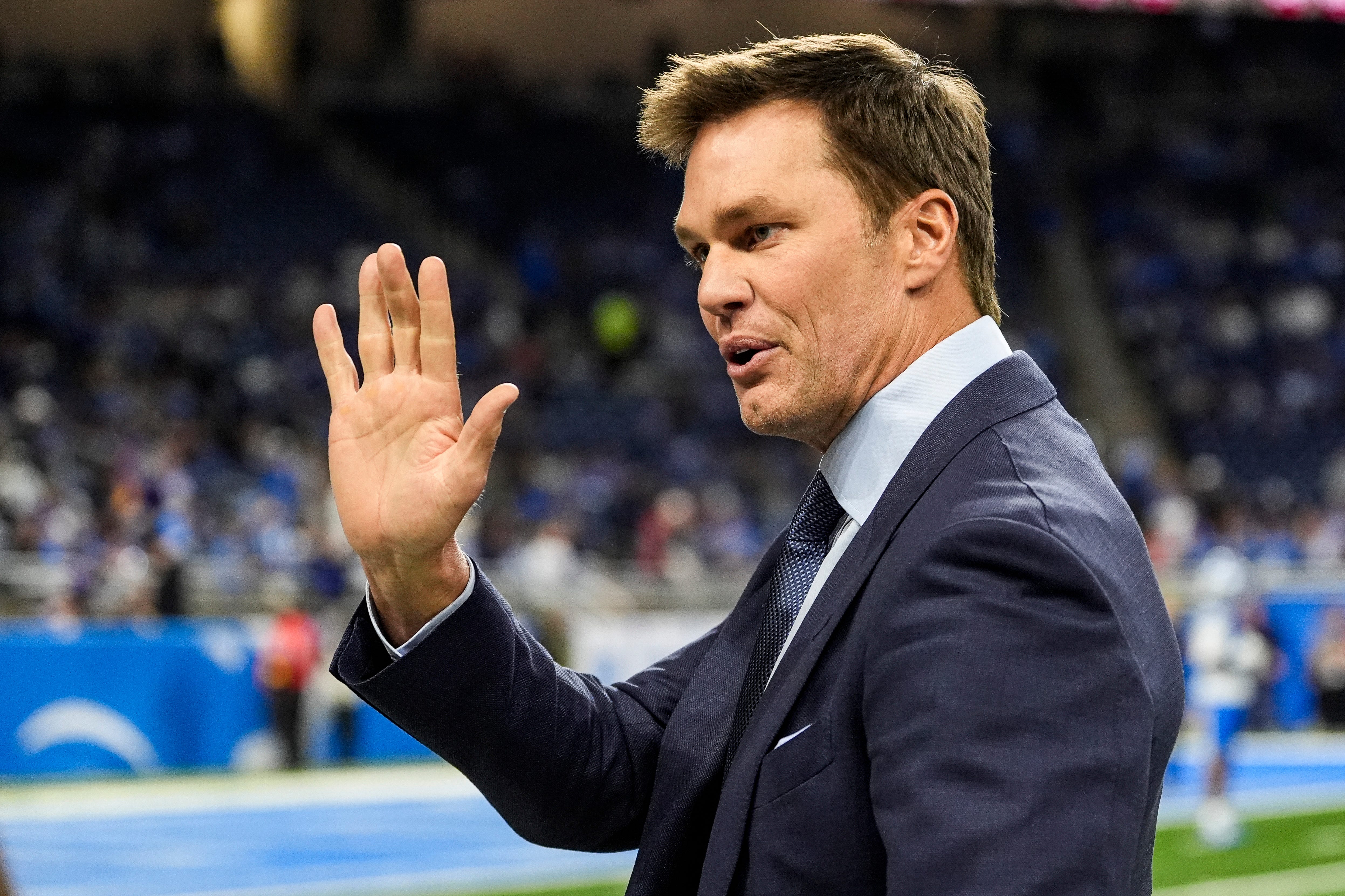 Tom Brady waves at Detroit Lions fans at Ford Field in Detroit on Sunday, November 2, 2025.
