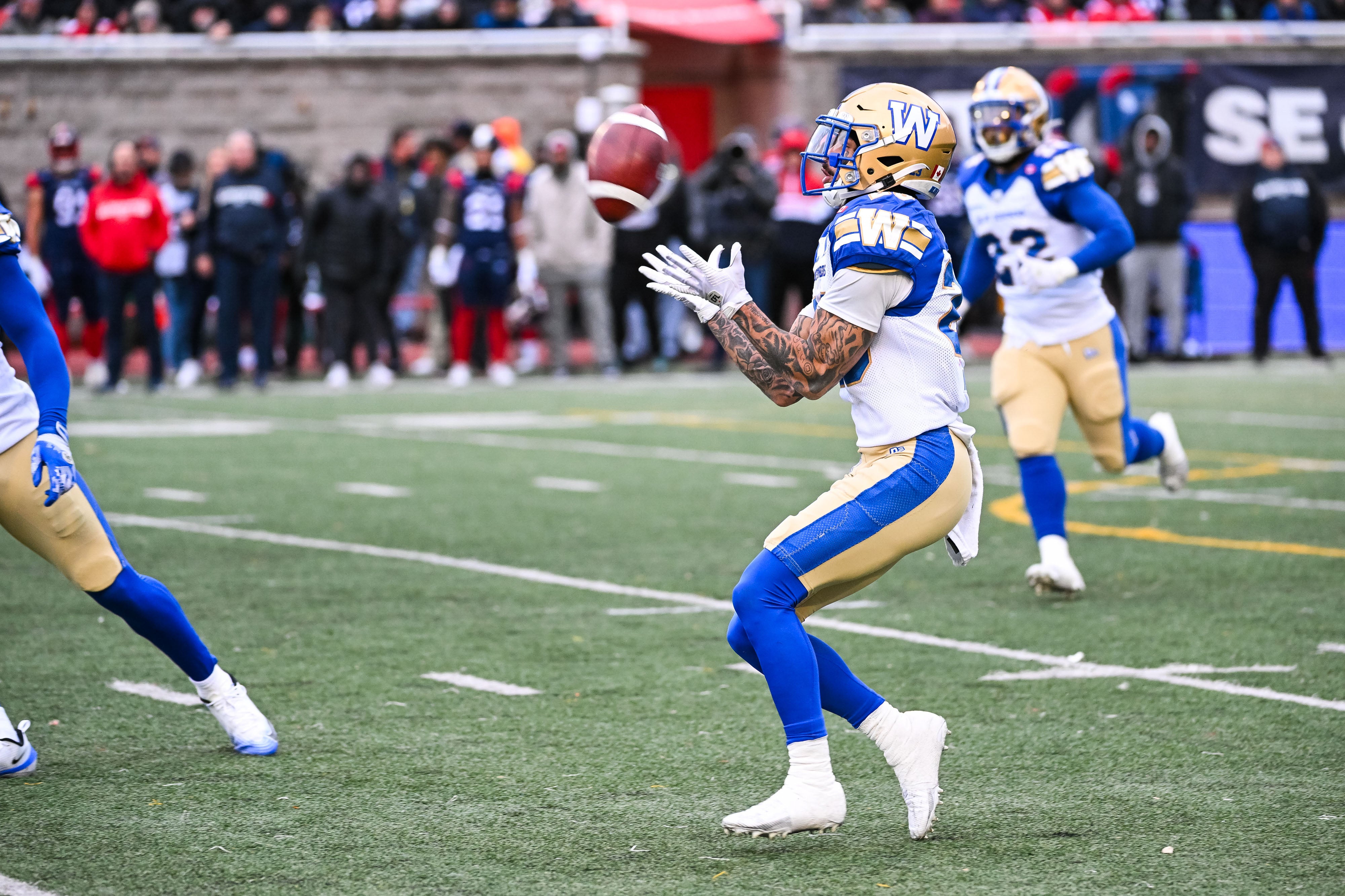 Nov 1, 2025; Montreal, Quebec, Canada; Winnipeg Blue Bombers defensive back Trey Vaval (23) catches a punt against the Montreal Alouettes during the fourth quarter at Percival-Molson stadium.