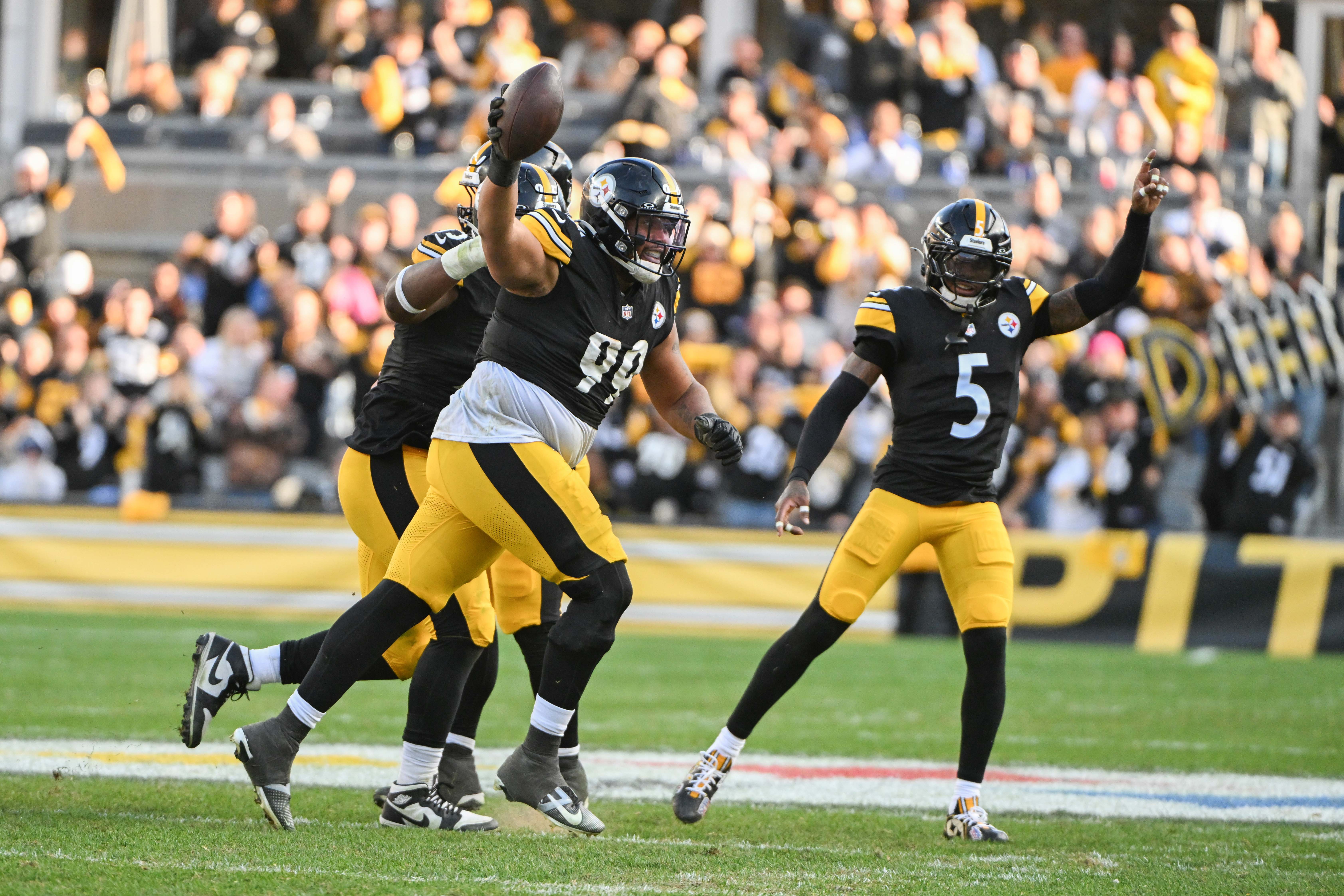 Nov 2, 2025; Pittsburgh, Pennsylvania, USA; Pittsburgh Steelers defensive tackle Derrick Harmon (99) celebrates with Jalen Ramsey (5) after recovering a fumble by Indianapolis Colts quarterback Daniel Jones (17) during the second half at Acrisure Stadium.