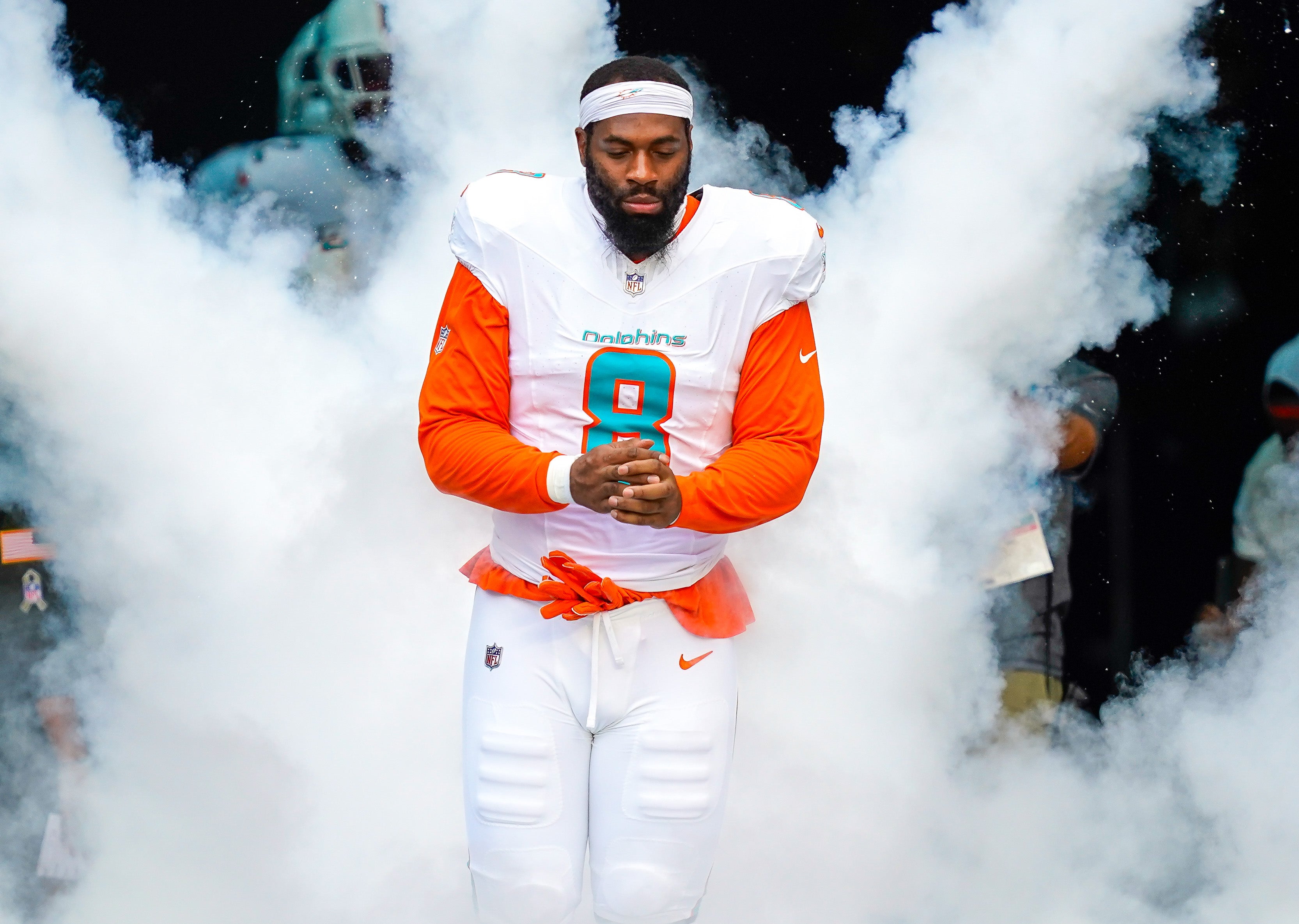 Nov 9, 2025; Miami Gardens, Florida, USA; Miami Dolphins outside linebacker Matthew Judon (8) runs on the field before a game against the Buffalo Bills at Hard Rock Stadium.