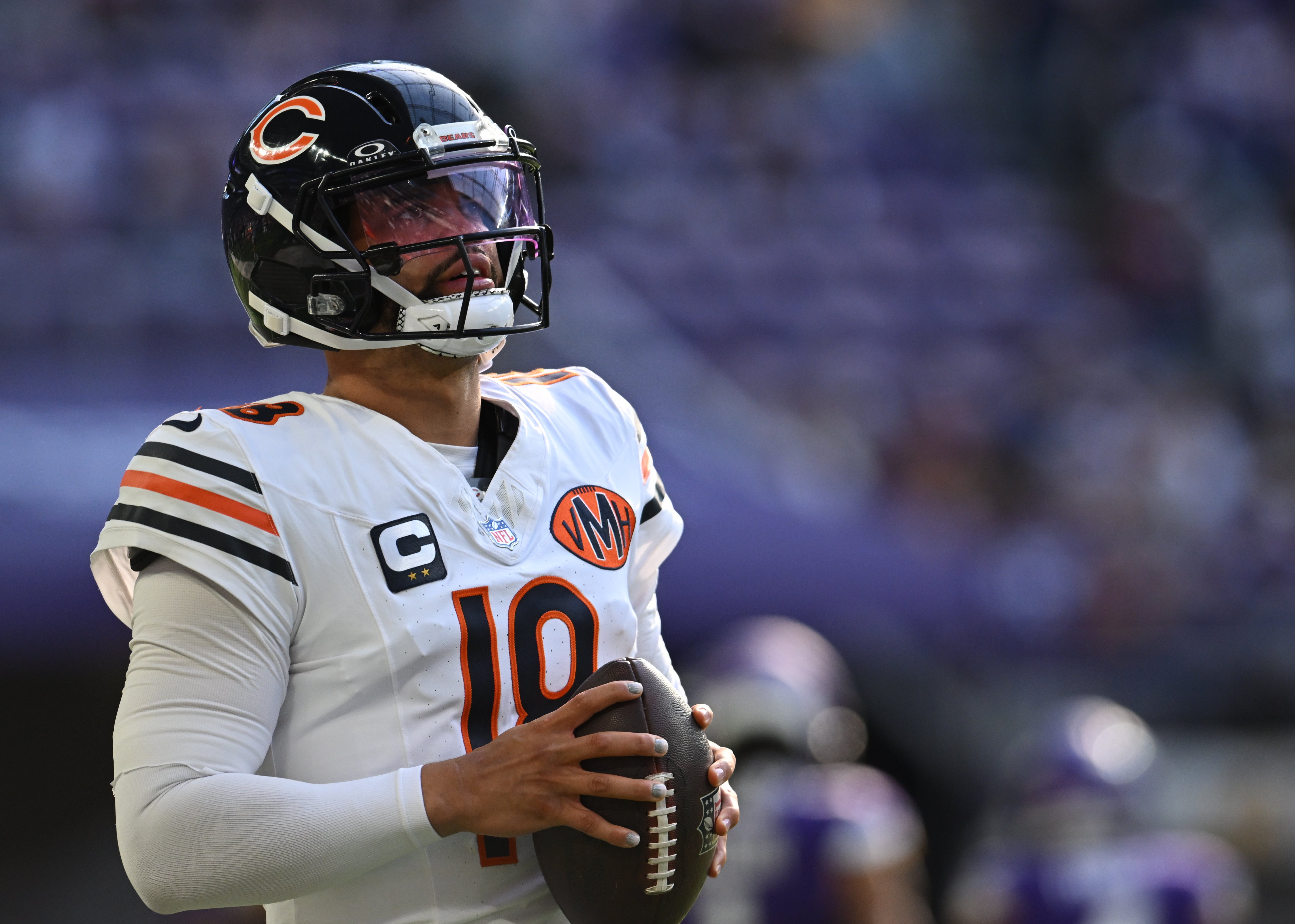 Nov 16, 2025; Minneapolis, Minnesota, USA; Chicago Bears quarterback Caleb Williams (18) warms up before a game against the Minnesota Vikings at U.S. Bank Stadium.
