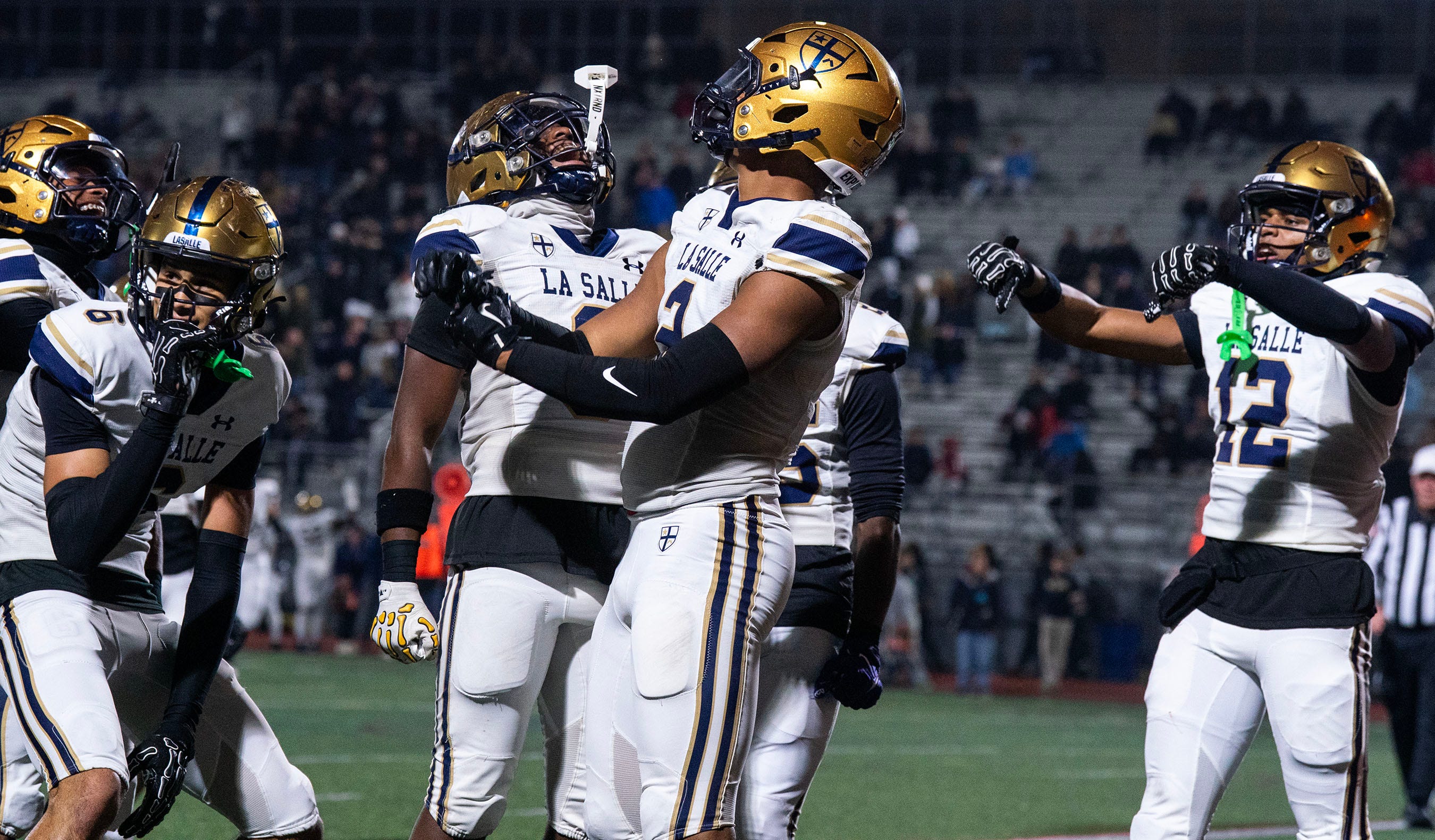 La Salle's JP Oates, 2, celebrates his touchdown against Easton with teammates, Joey O'Brien, 6, Josh Simmons, 8, and Chima Auguste, 12, during the PIAA football quarterfinals in Bethlehem on Nov. 21, 2025.