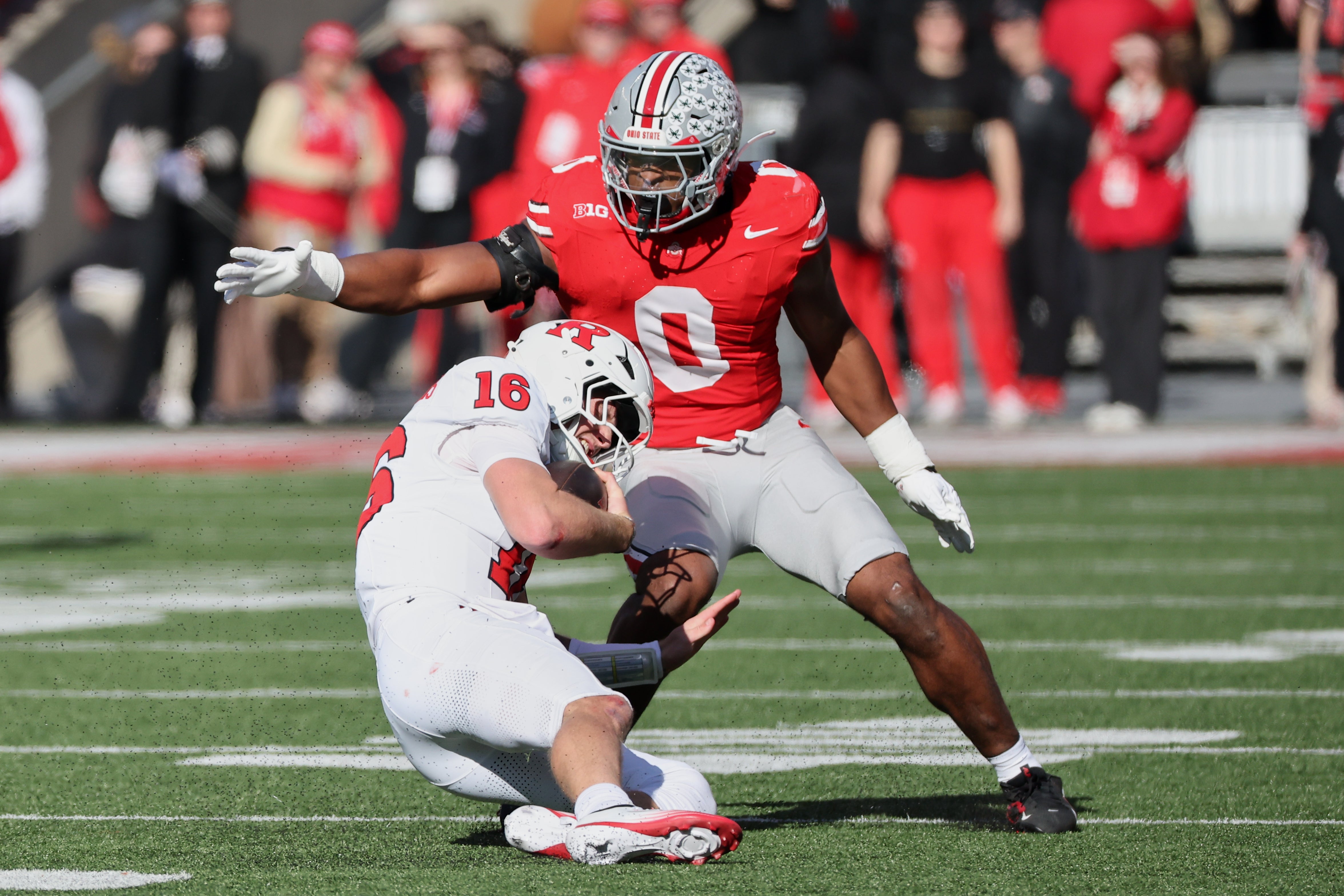 Nov 22, 2025; Columbus, Ohio, USA; Ohio State Buckeyes linebacker Sonny Styles (0) tackles Rutgers Scarlet Knights quarterback Athan Kaliakmanis (16) during the first quarter at Ohio Stadium.