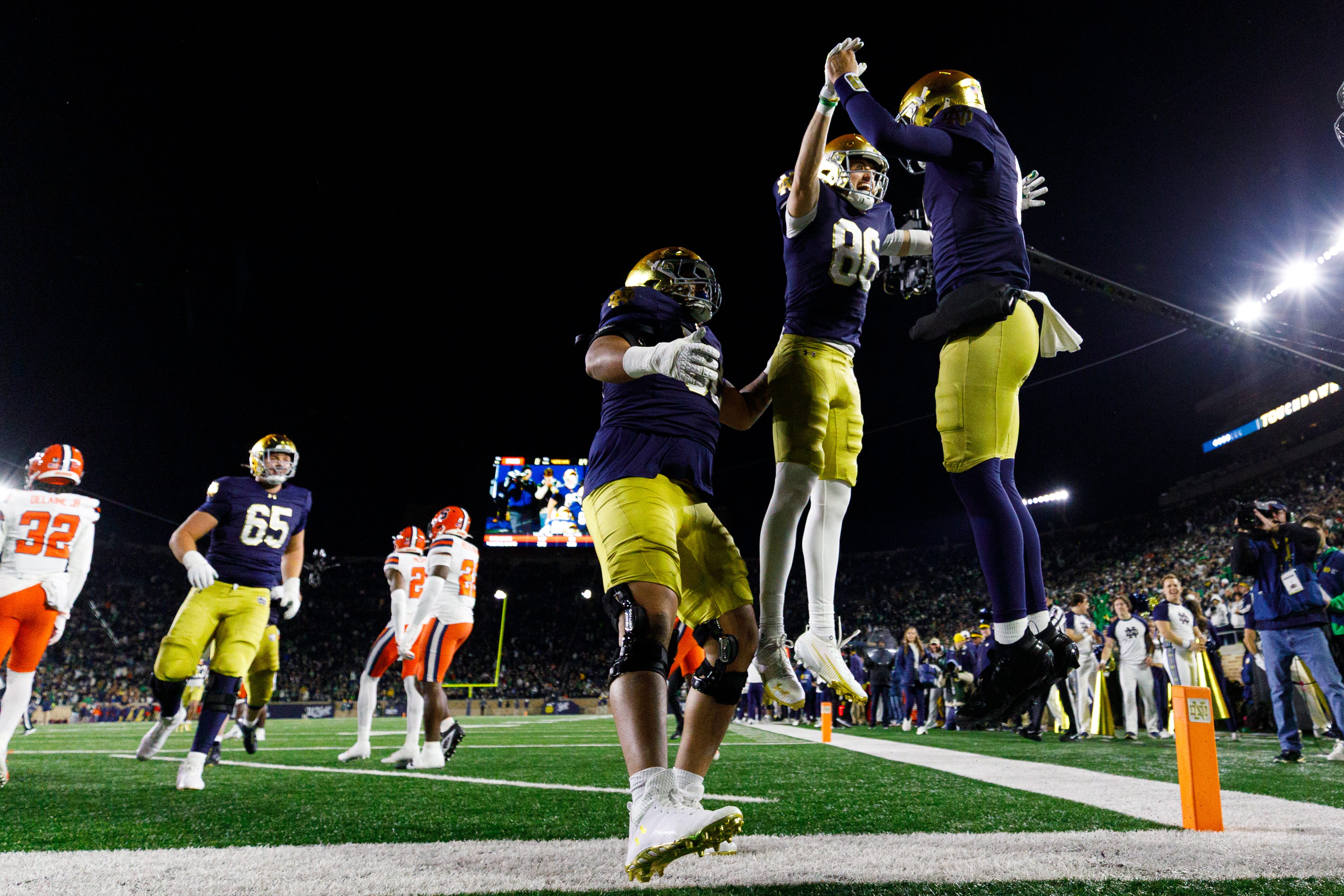 Notre Dame quarterback Kenny Minchey, right, celebrates with wide receiver Alex Whitman (86) after a Minchey touchdown in the second half of a NCAA football game against Syracuse at Notre Dame Stadium on Saturday, Nov. 22, 2025, in South Bend.