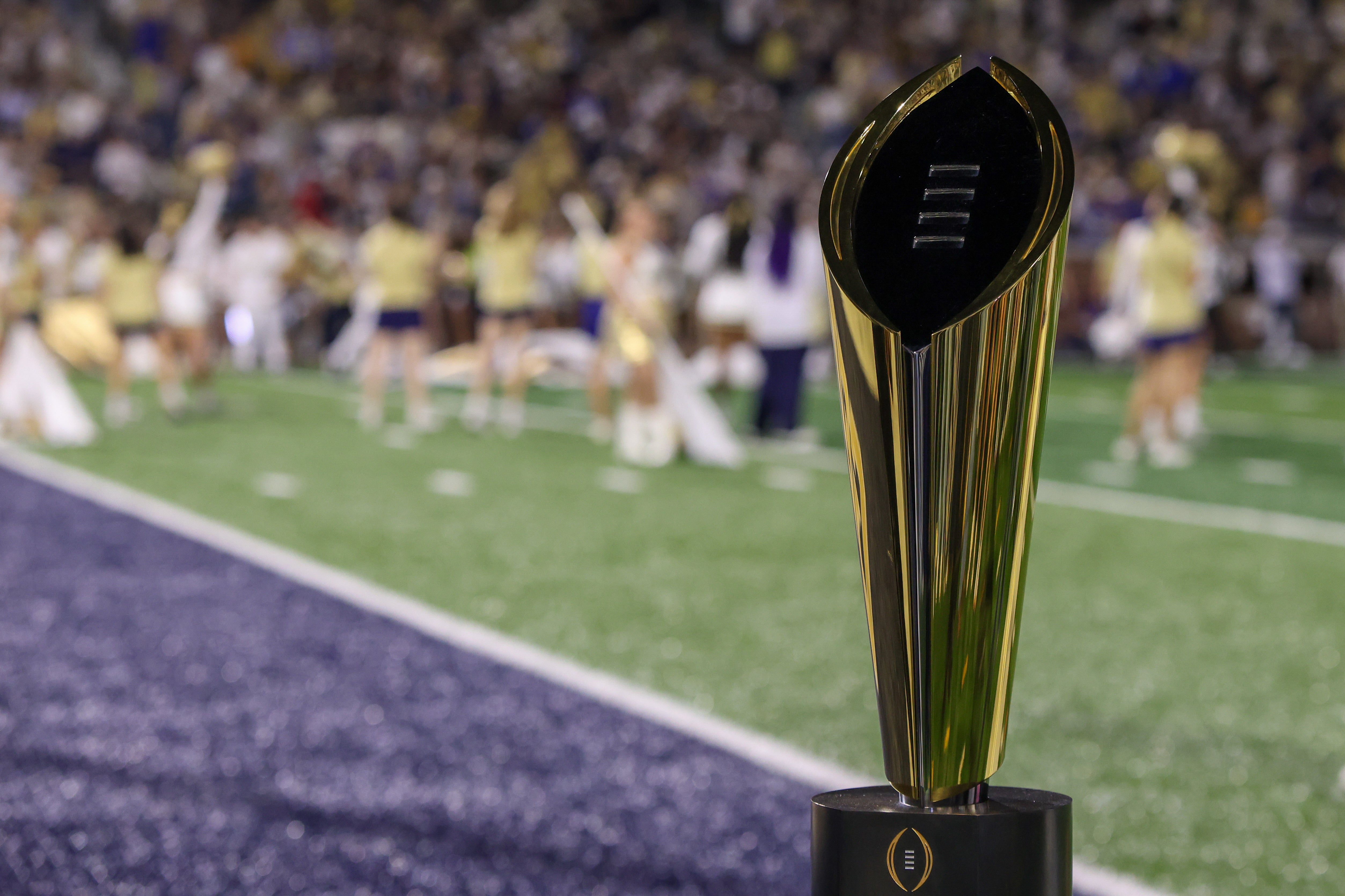 Nov 22, 2025; Atlanta, Georgia, USA; A view of the college football playoff national championship trophy on the sidelines of a game between the Georgia Tech Yellow Jackets and Pittsburgh Panthers in the first quarter at Bobby Dodd Stadium at Hyundai Field. Mandatory Credit: Brett Davis-Imagn Images