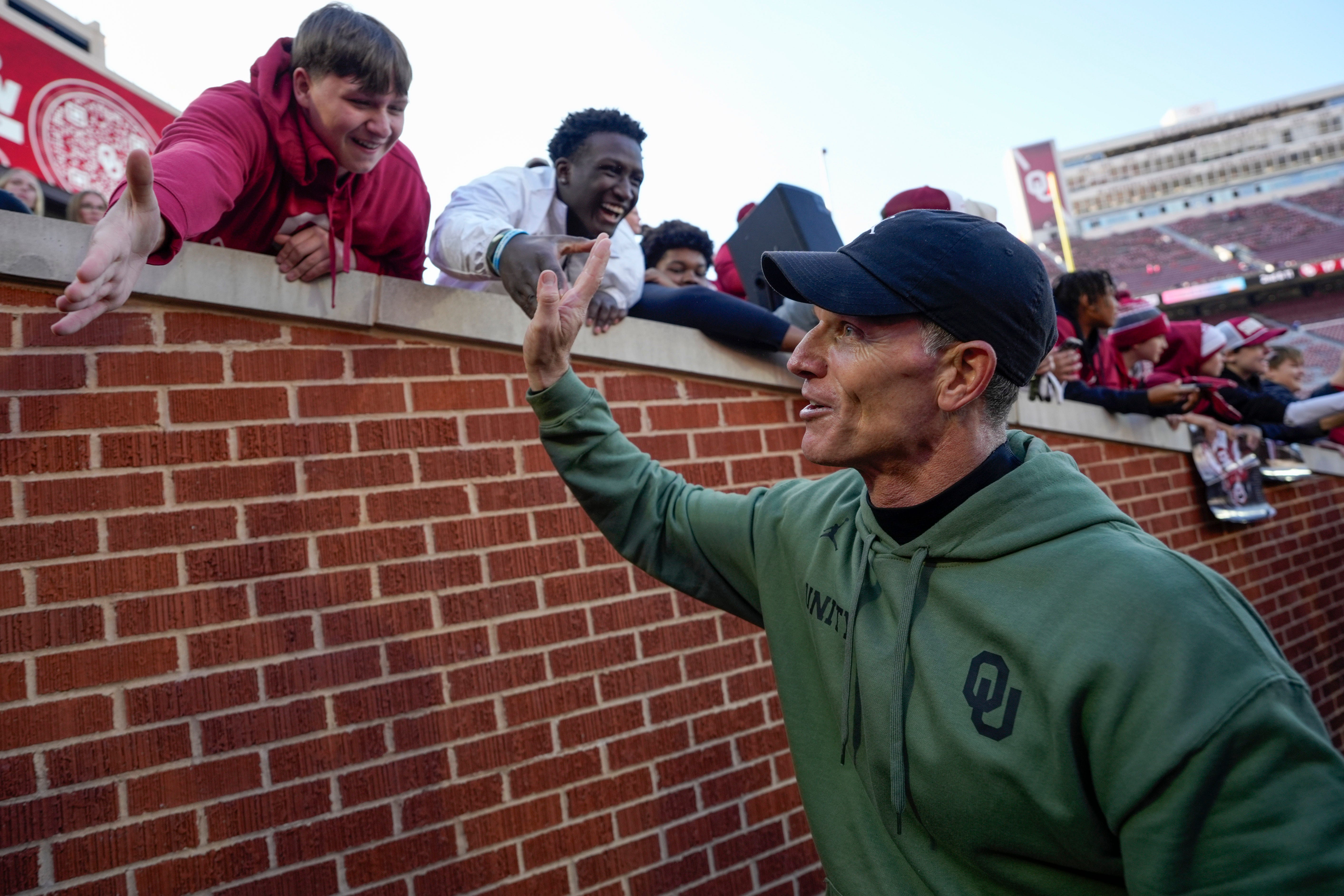 Oklahoma coach Brent Venables celebrates with fans after a college football game between the University of Oklahoma Sooners (OU) and the Missouri Tigers at Gaylord Family Ð Oklahoma Memorial Stadium in Norman, Okla., on Saturday, Nov. 22, 2025. Oklahoma won 17-6.