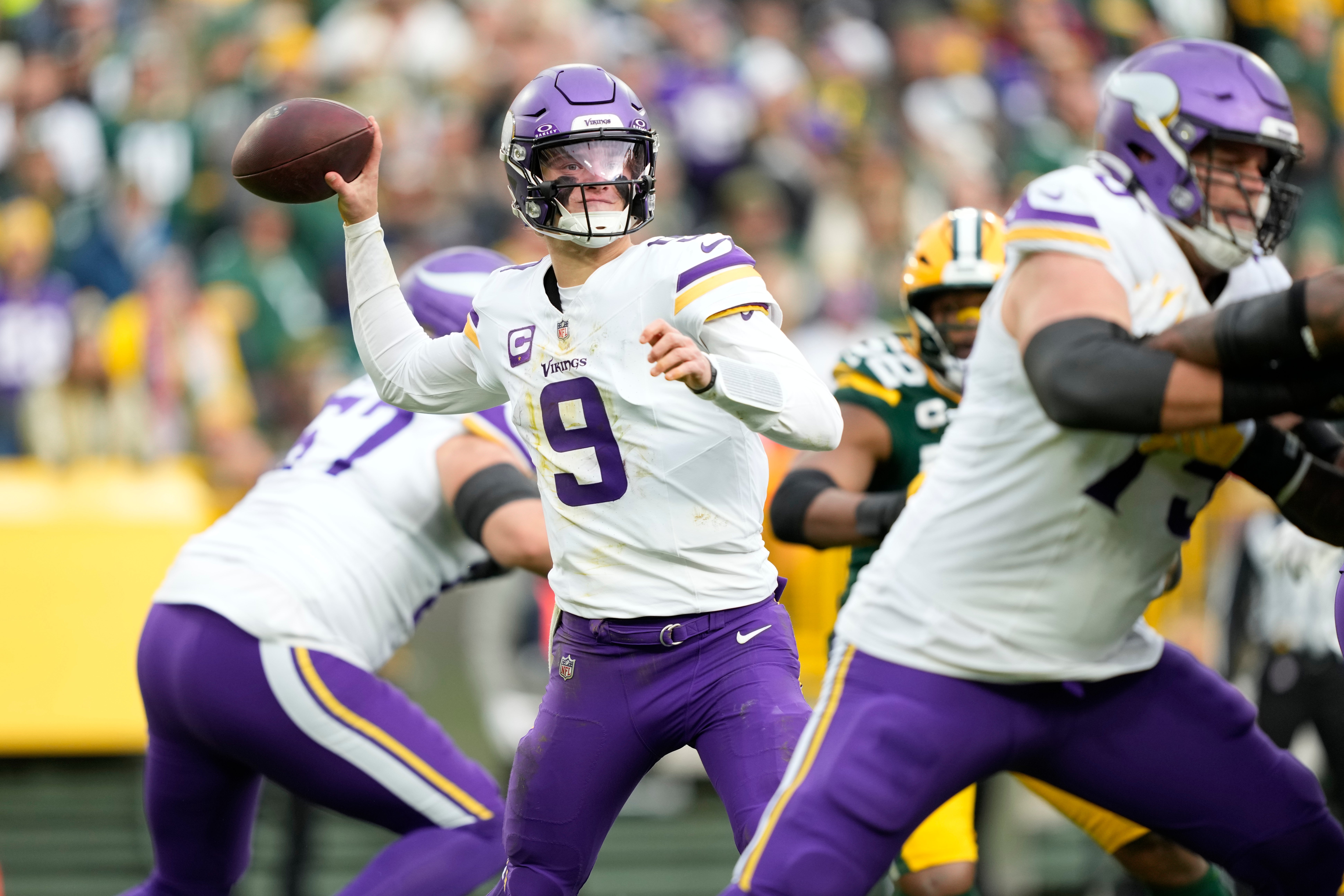 Nov 23, 2025; Green Bay, Wisconsin, USA; Minnesota Vikings quarterback J.J. McCarthy (9) throws the ball against the Green Bay Packers during the second half at Lambeau Field.