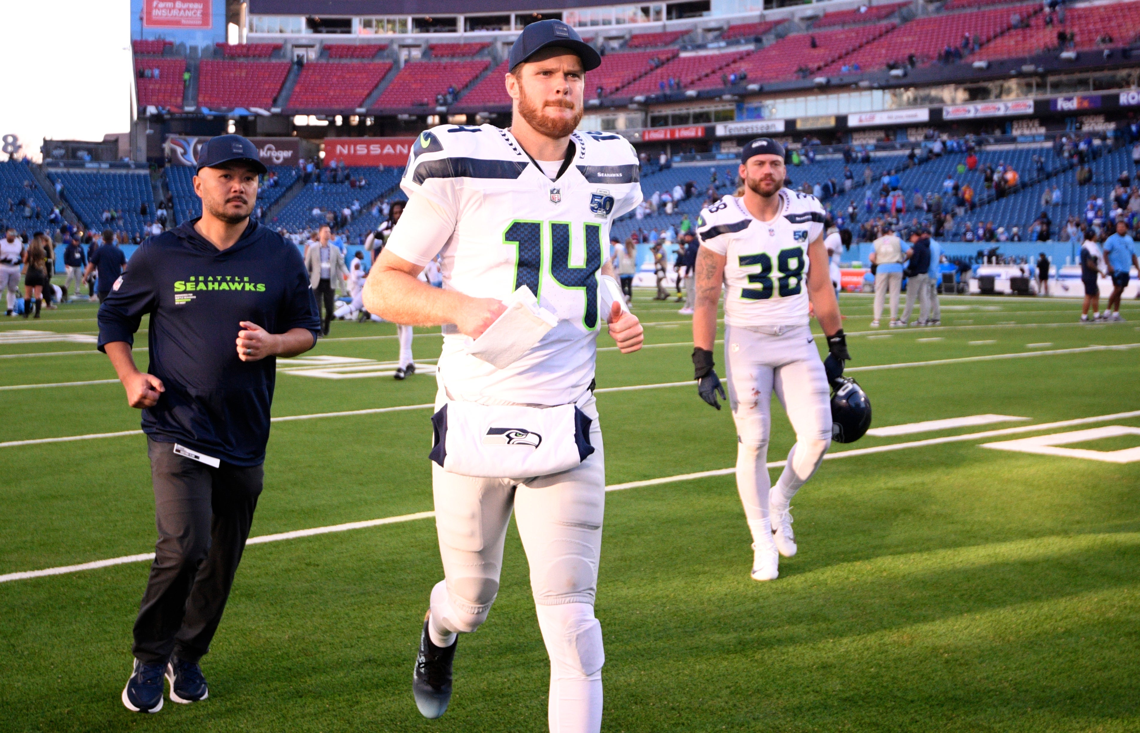 Nov 23, 2025; Nashville, Tennessee, USA; Seattle Seahawks quarterback Sam Darnold (14) leaves the field after a game against the Tennessee Titans at Nissan Stadium.