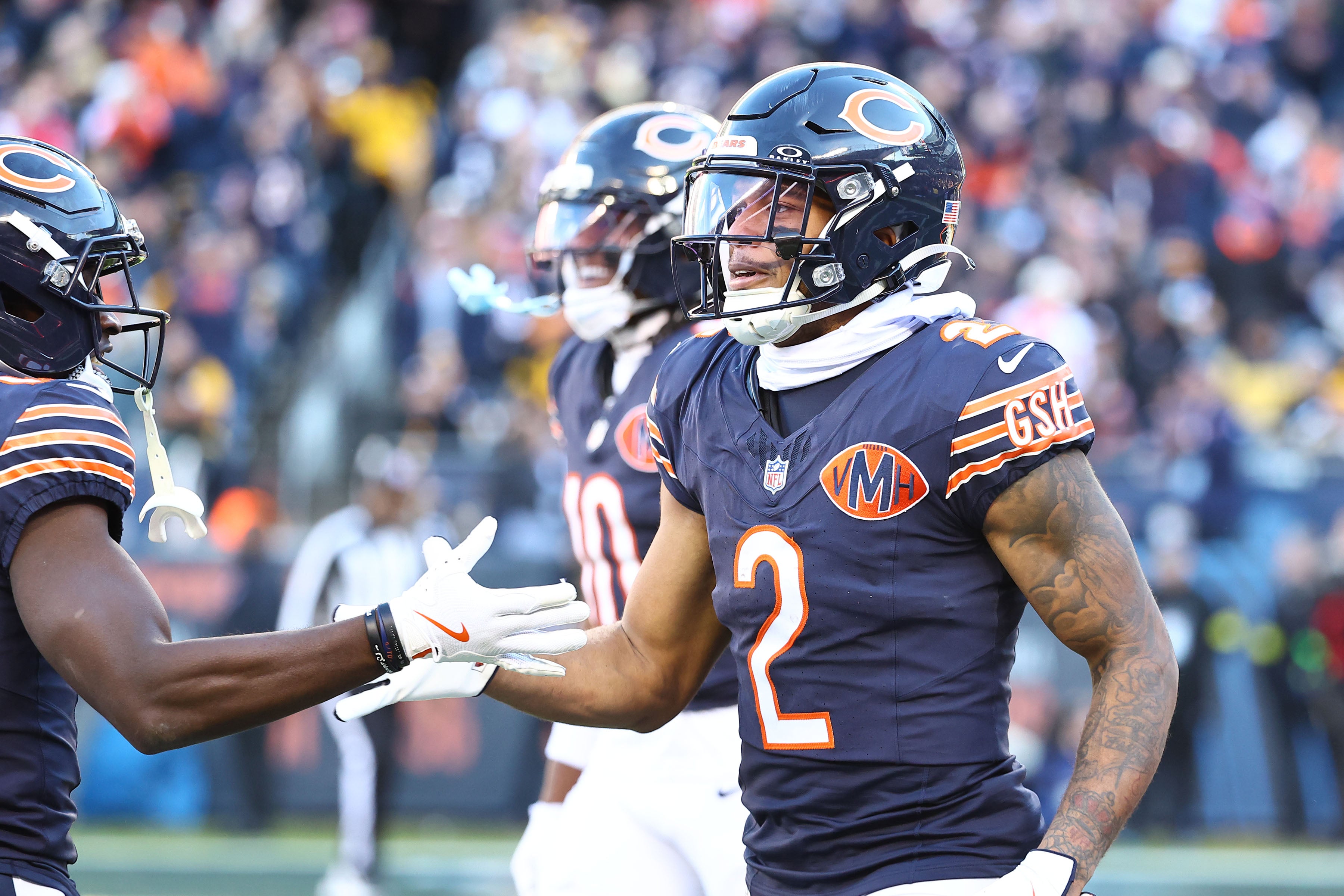 Nov 23, 2025; Chicago, Illinois, USA; Chicago Bears wide receiver DJ Moore (2) reacts after making a touchdown catch against the Pittsburgh Steelers during the second half at Soldier Field.