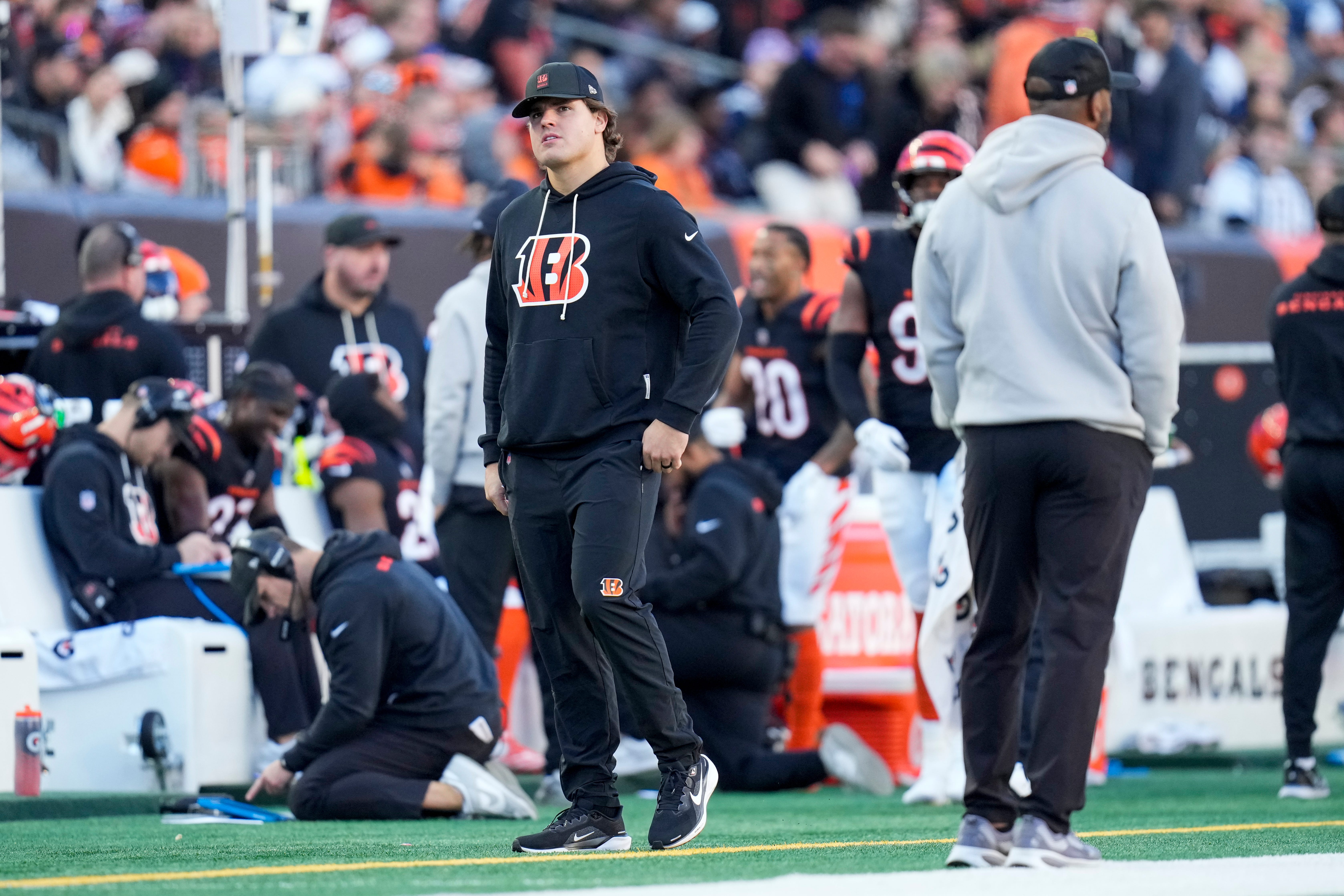 Injured Cincinnati Bengals defensive end Trey Hendrickson (91) walks the sideline in the fourth quarter of the NFL Week 12 game between the Cincinnati Bengals and the New England Patriots at Paycor Stadium in downtown Cincinnati on Sunday, Nov. 23, 2025. The Bengals fall to 3-8 with a 26-20 loss at home.