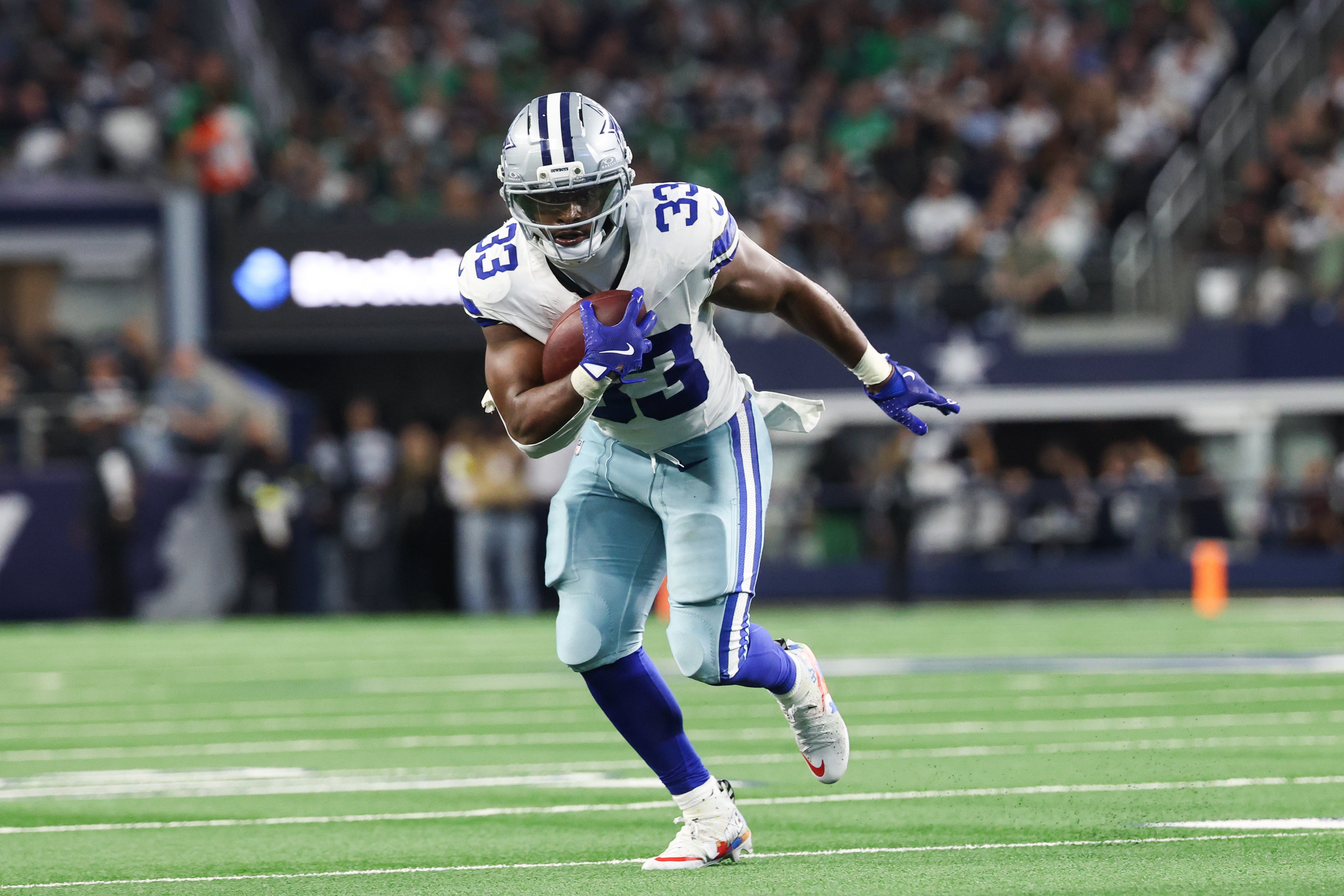 Nov 23, 2025; Arlington, Texas, USA; Dallas Cowboys running back Javonte Williams (33) runs with the ball in the second quarter against the Philadelphia Eagles at AT&T Stadium.