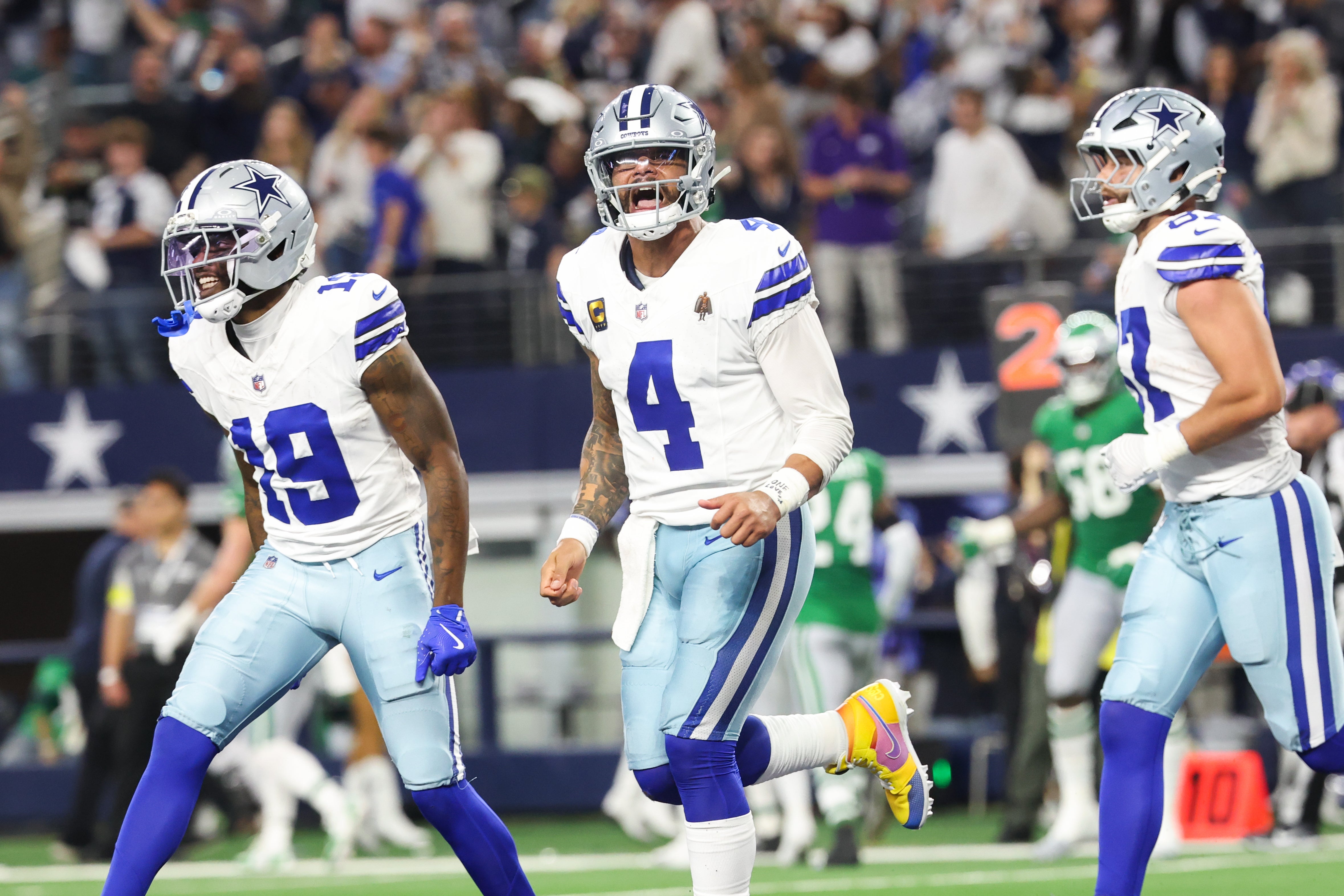 Nov 23, 2025; Arlington, Texas, USA; Dallas Cowboys quarterback Dak Prescott (4) celebrates a touchdown in the fourth quarter against the Philadelphia Eagles at AT&T Stadium.