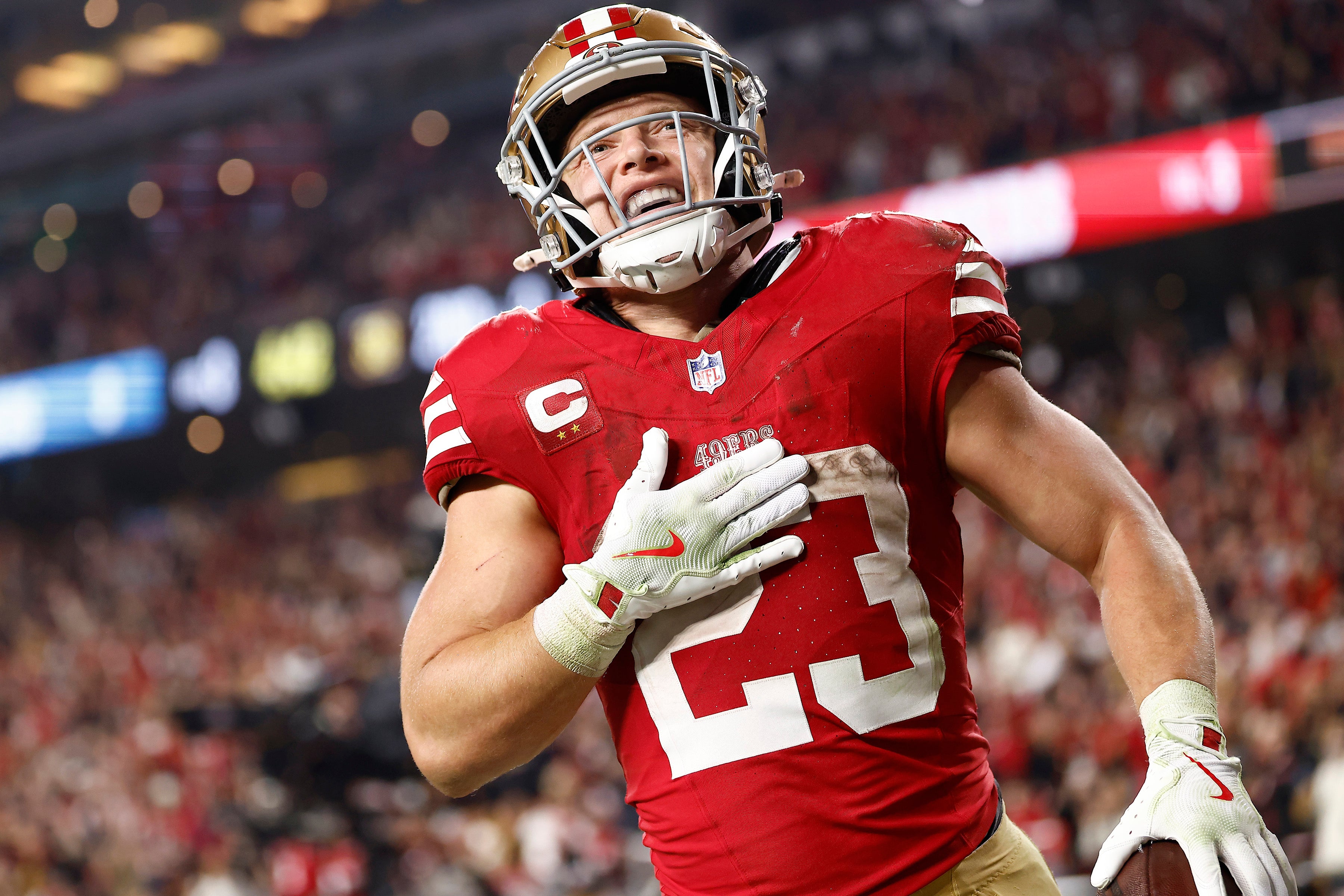 Nov 24, 2025; Santa Clara, California, USA; San Francisco 49ers running back Christian McCaffrey (23) reacts after scoring a touchdown against the Carolina Panthers during the second half at Levi's Stadium.