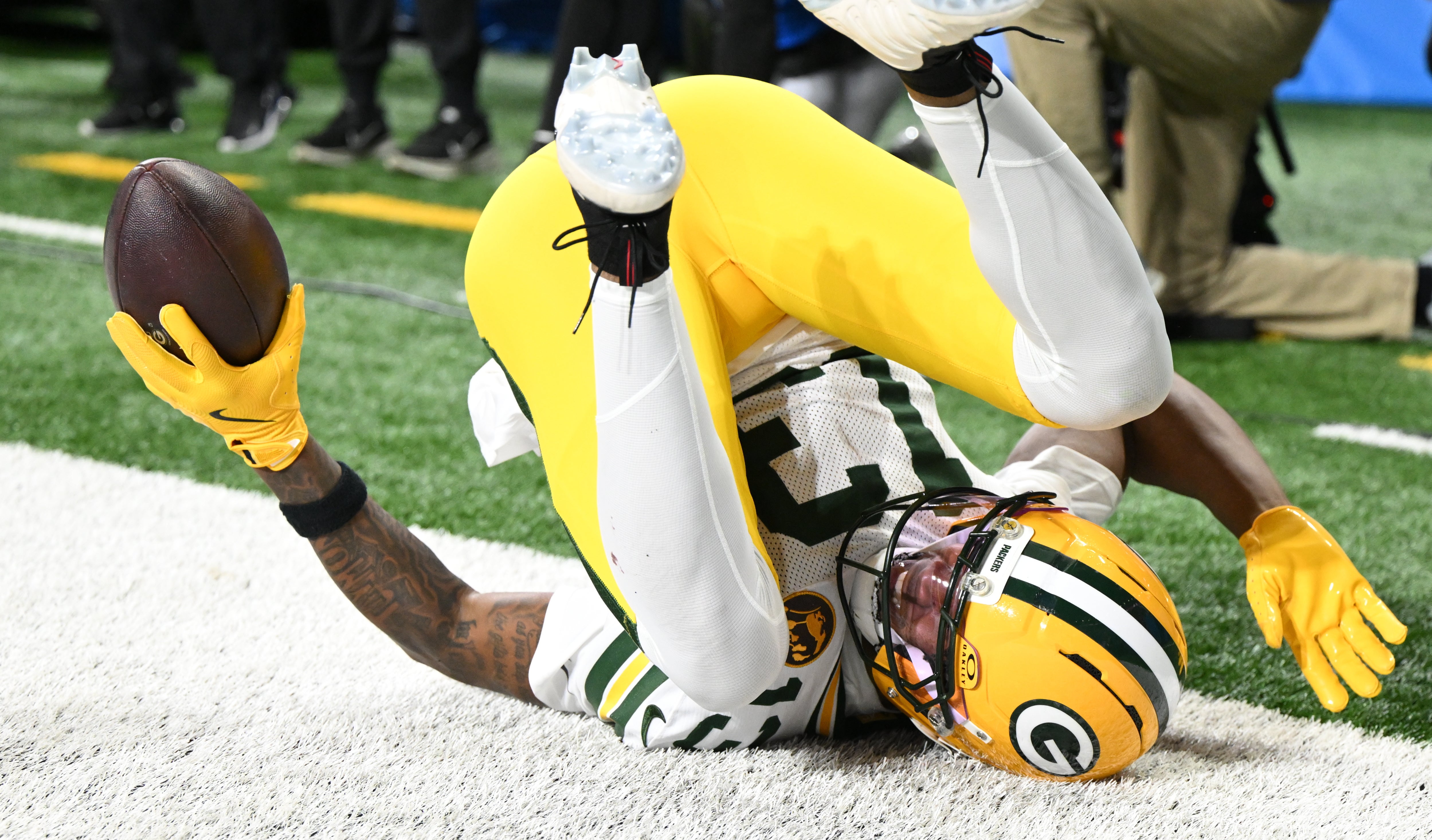 Nov 27, 2025; Detroit, Michigan, USA; Green Bay Packers wide receiver Dontayvion Wicks (13) catches a pass for a touchdown against the Detroit Lions during the second quarter at Ford Field.