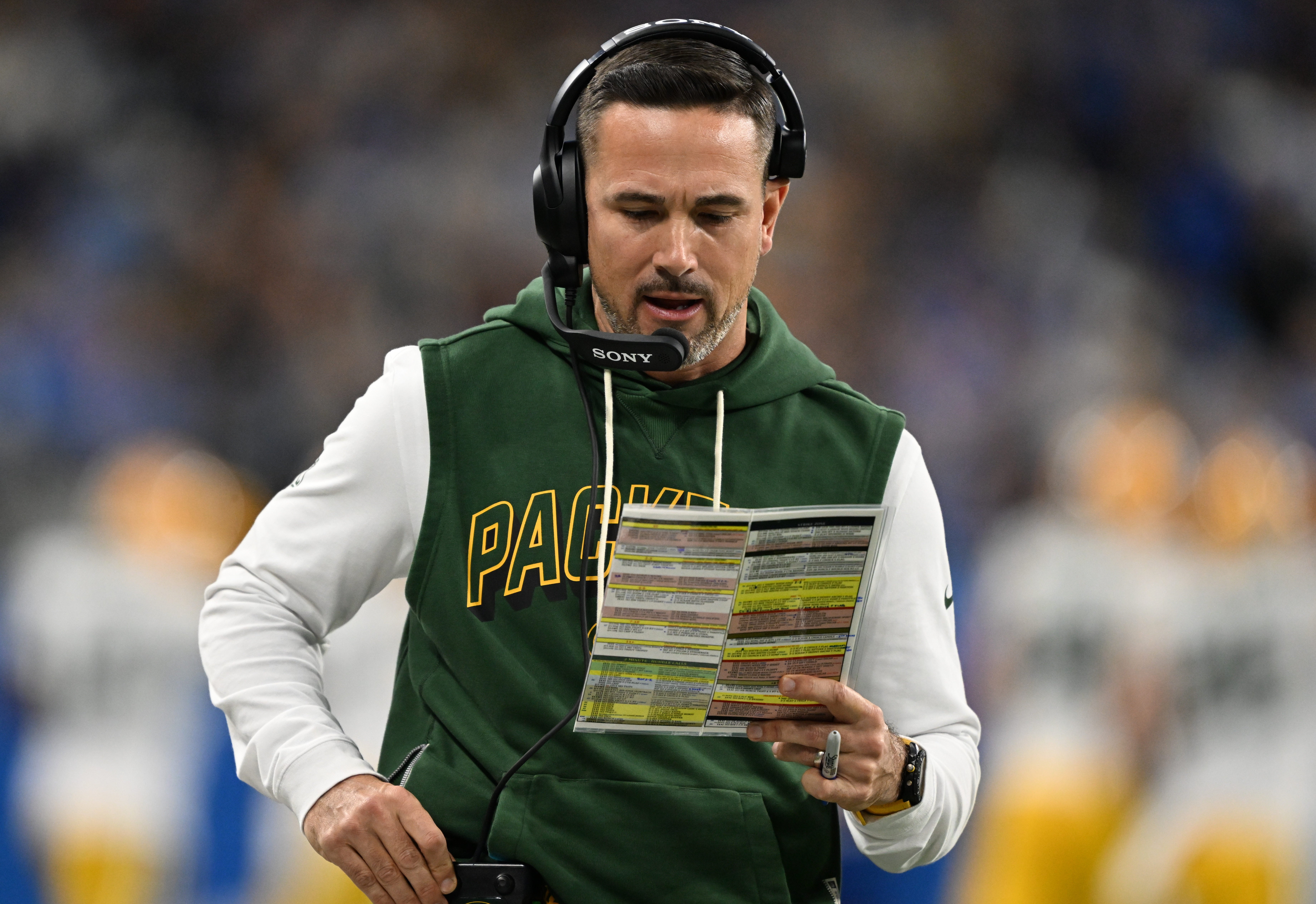 Nov 27, 2025; Detroit, Michigan, USA; Green Bay Packers head coach Matt LaFleur calls a play against the Detroit Lions during the first quarter at Ford Field.