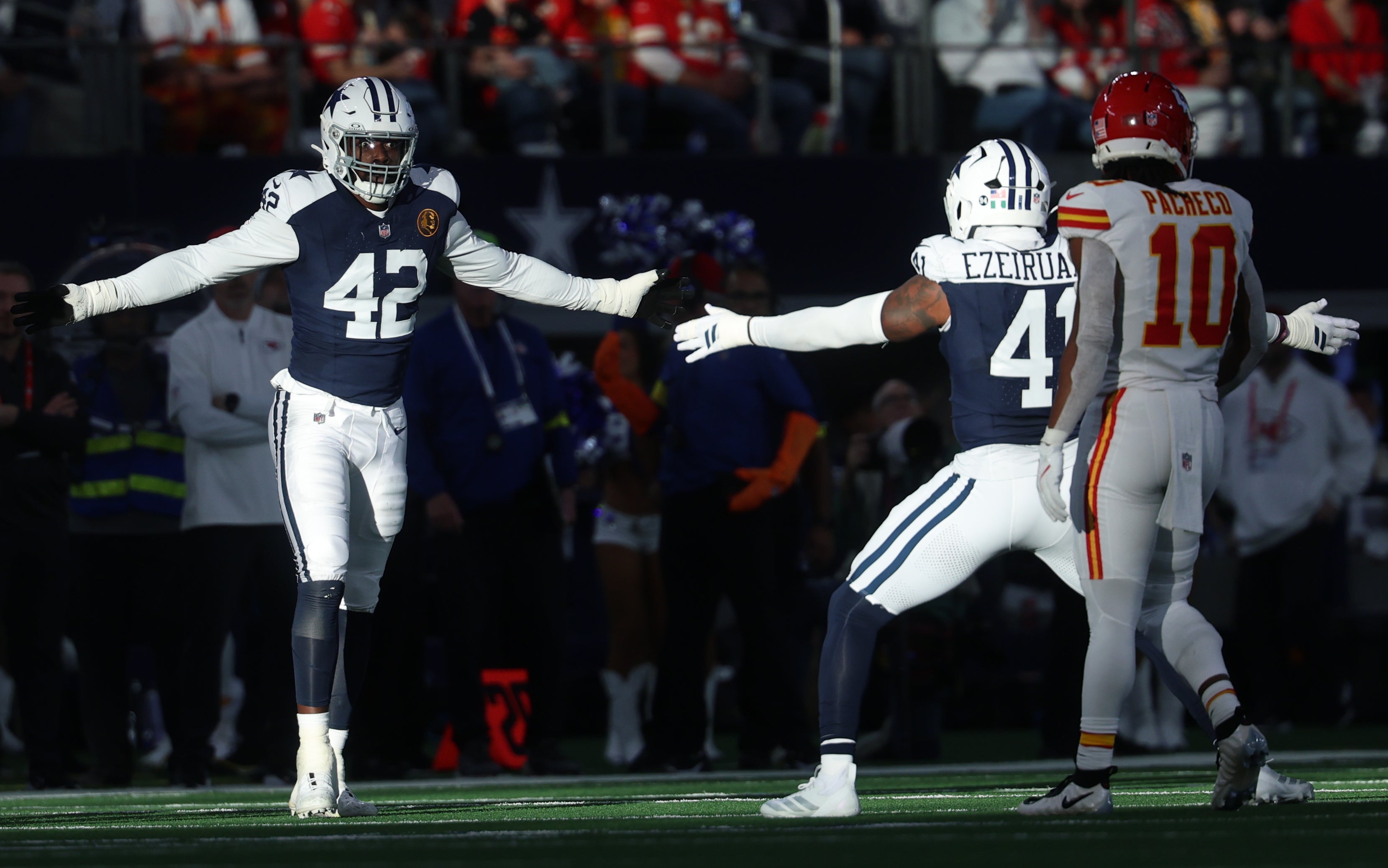 Dallas Cowboys defensive end Jadeveon Clowney (42) and Dallas Cowboys defensive end Donovan Ezeiruaku (41) celebrate after a play against the Kansas City Chiefs during the second quarter at AT&T Stadium.