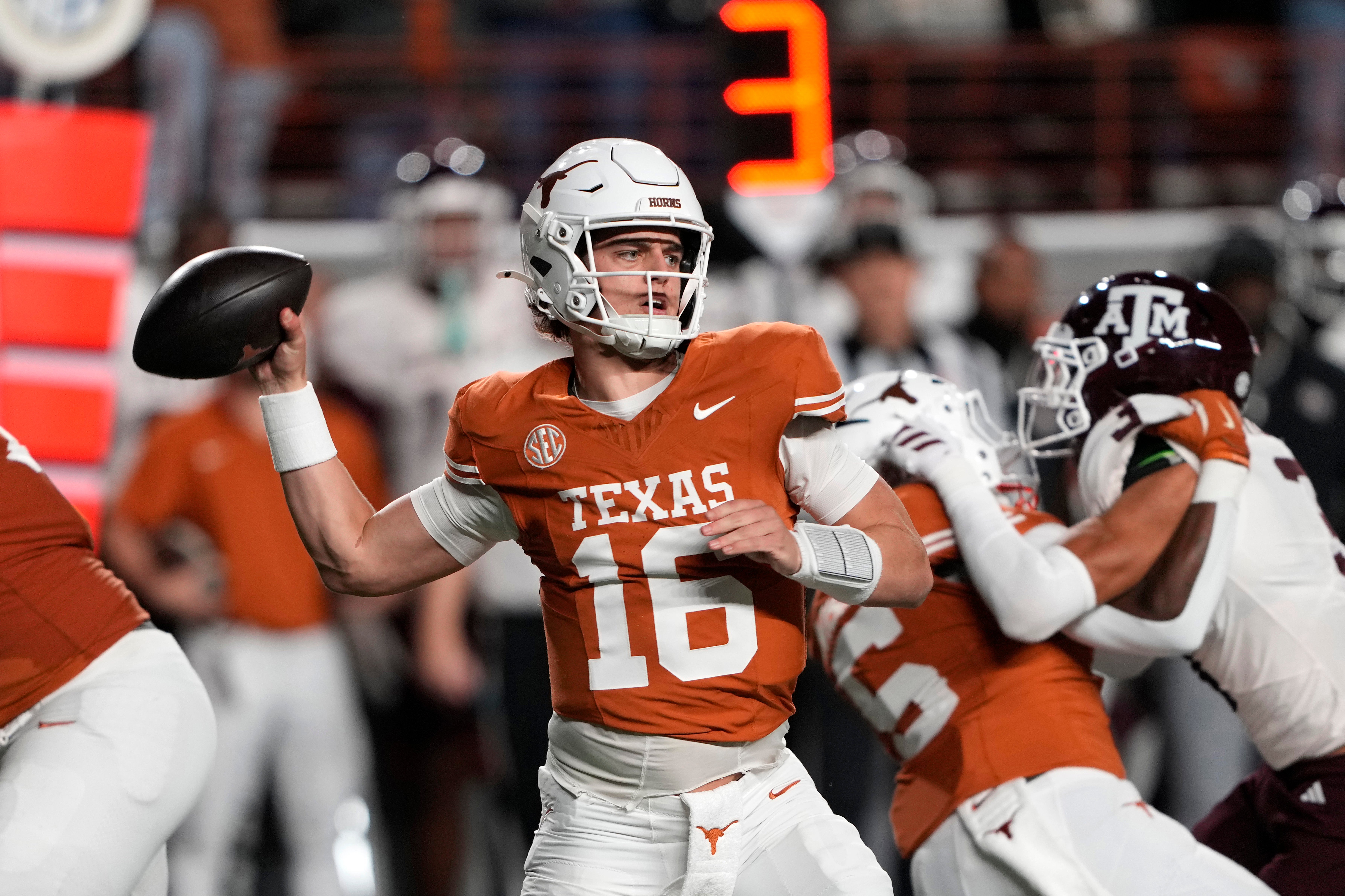 Nov 28, 2025; Austin, Texas, USA; Texas Longhorns quarterback Arch Manning throws a pass during the first half against the Texas A&M Aggies at Darrell K Royal-Texas Memorial Stadium.