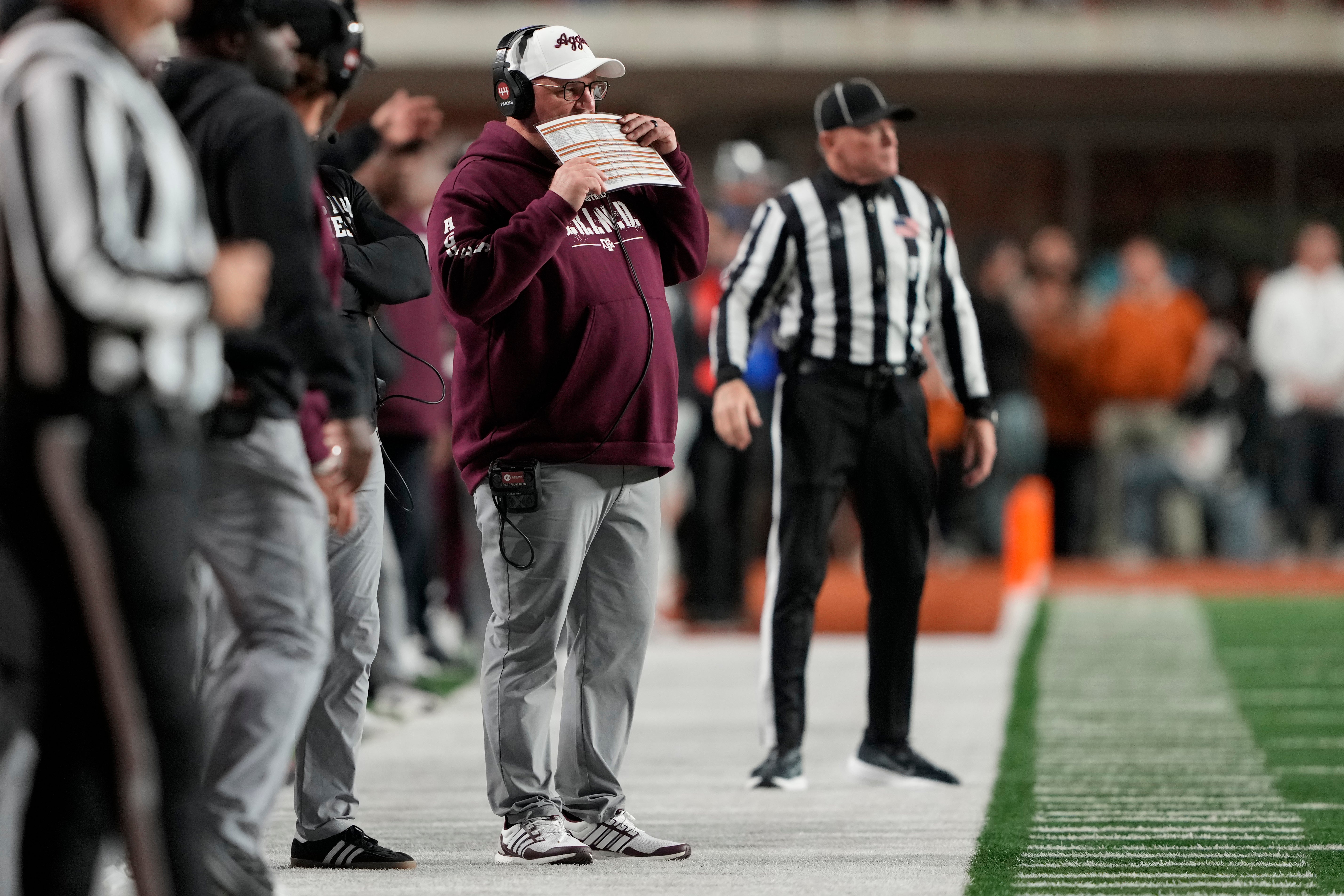 Nov 28, 2025; Austin, Texas, USA; Texas A&M Aggies head coach Mike Elko calls a play during the first half against the Texas Longhorns at Darrell K Royal-Texas Memorial Stadium.