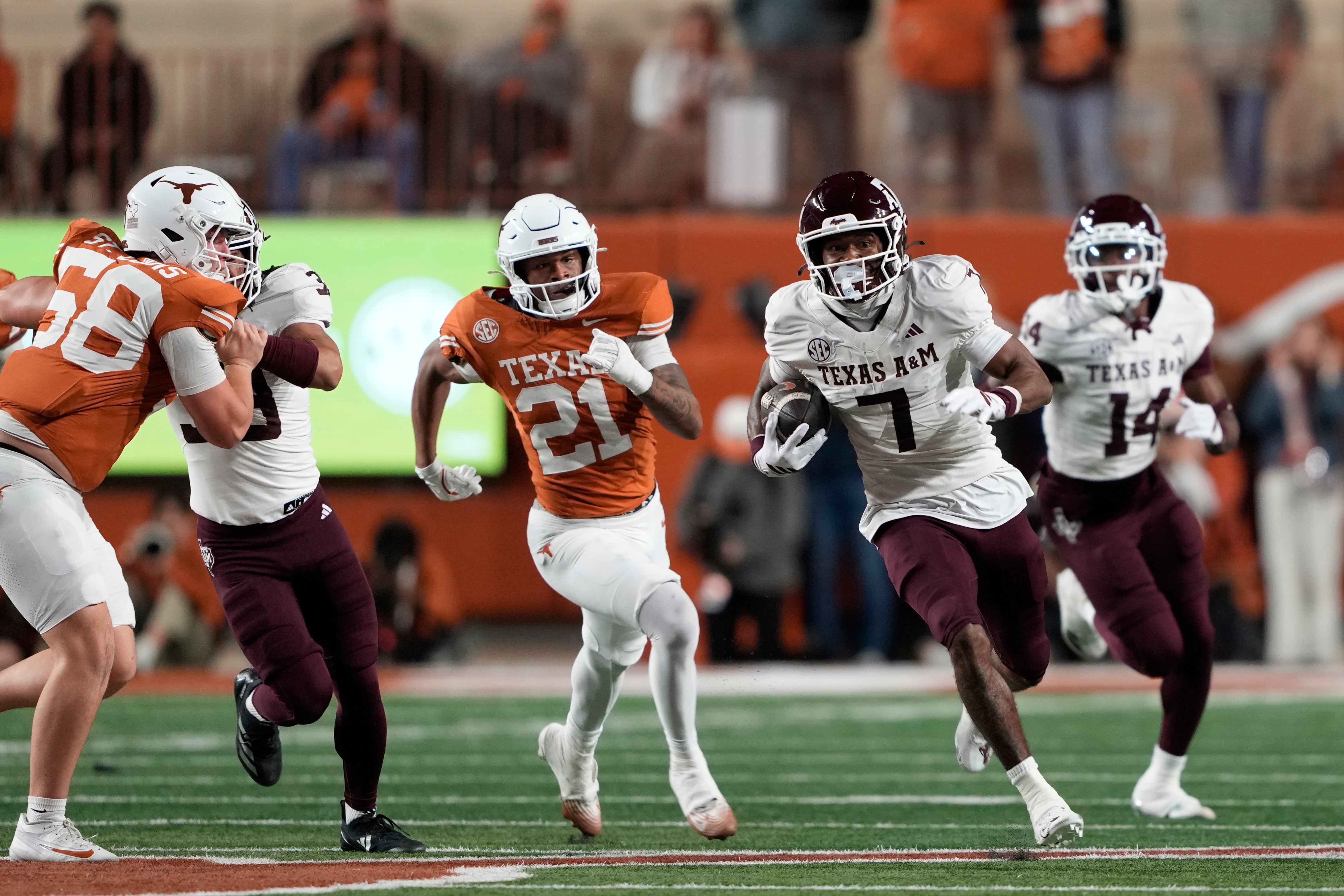 Nov 28, 2025; Austin, Texas, USA; Texas A&M Aggies wide receiver KC Concepcion (7) returns a punt during the first half against the Texas Longhorns at Darrell K Royal-Texas Memorial Stadium. Mandatory Credit: Scott Wachter-Imagn Images