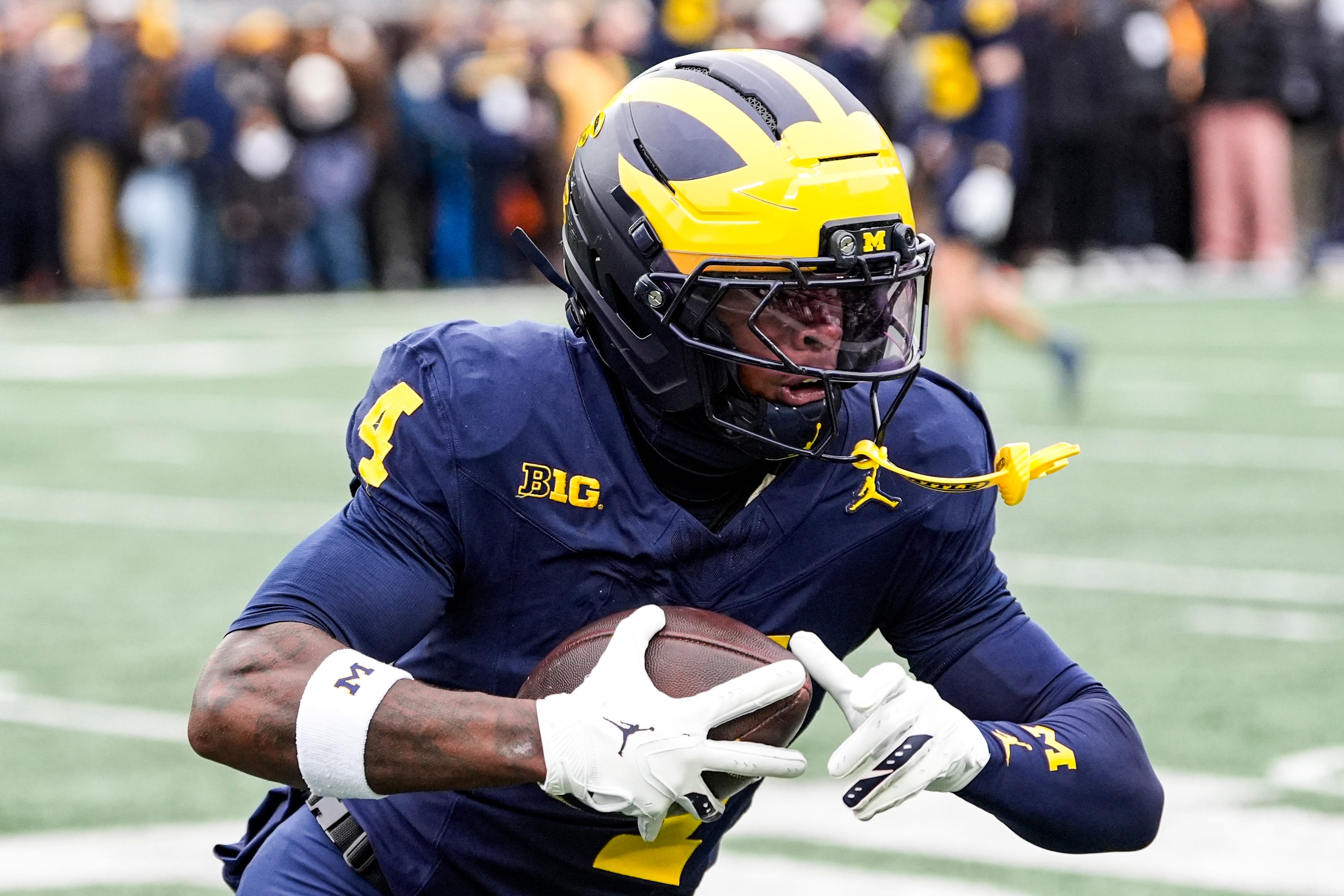 Michigan wide receiver Andrew Marsh (4) warms up at Michigan Stadium in Ann Arbor on Saturday, Nov. 29, 2025.