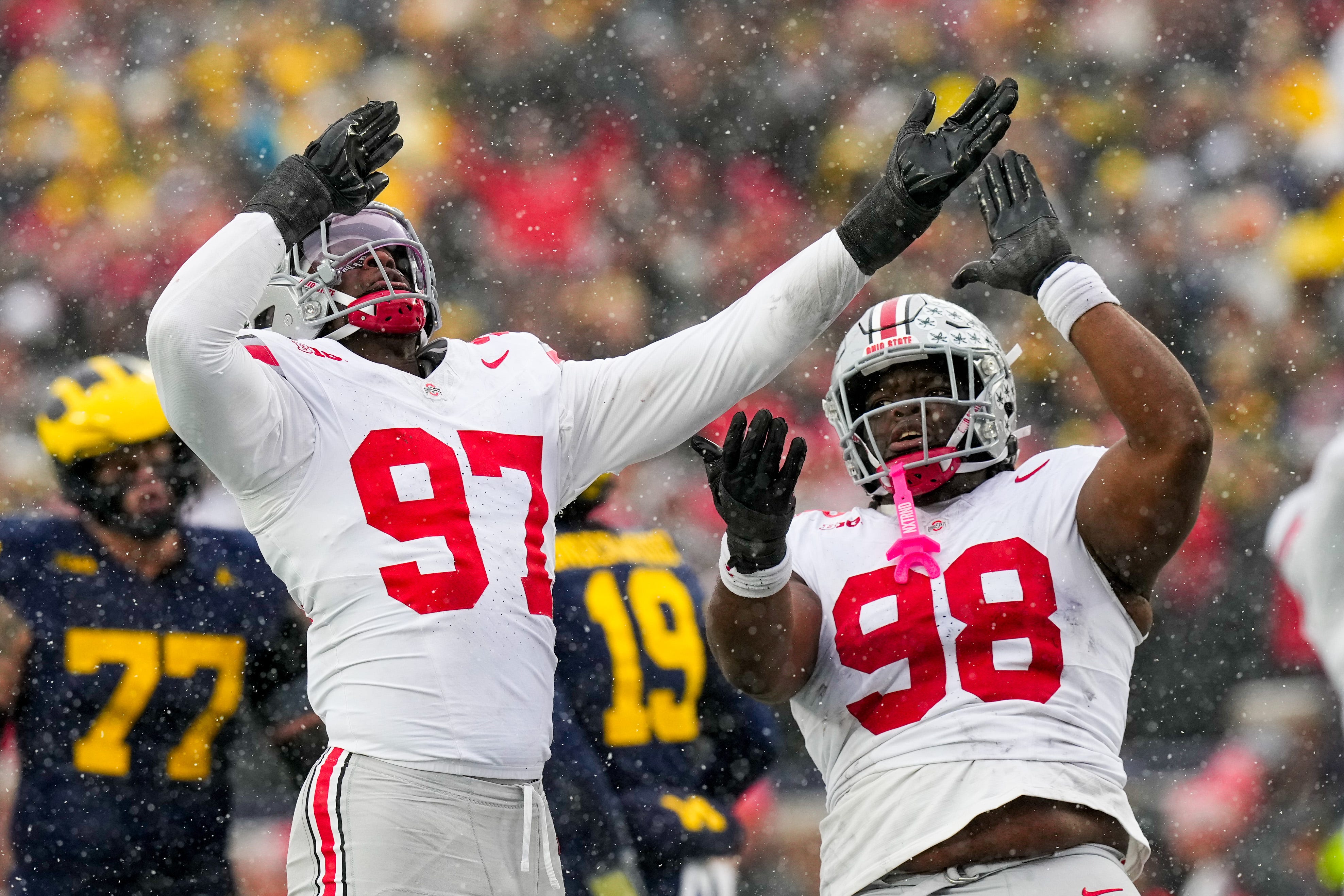 Ohio State Buckeyes defensive end Kenyatta Jackson Jr. (97) and defensive tackle Kayden McDonald (98) celebrate in the second half of the NCAA football game at Michigan Stadium on Saturday, Nov. 29, 2025 in Ann Arbor, Michigan.