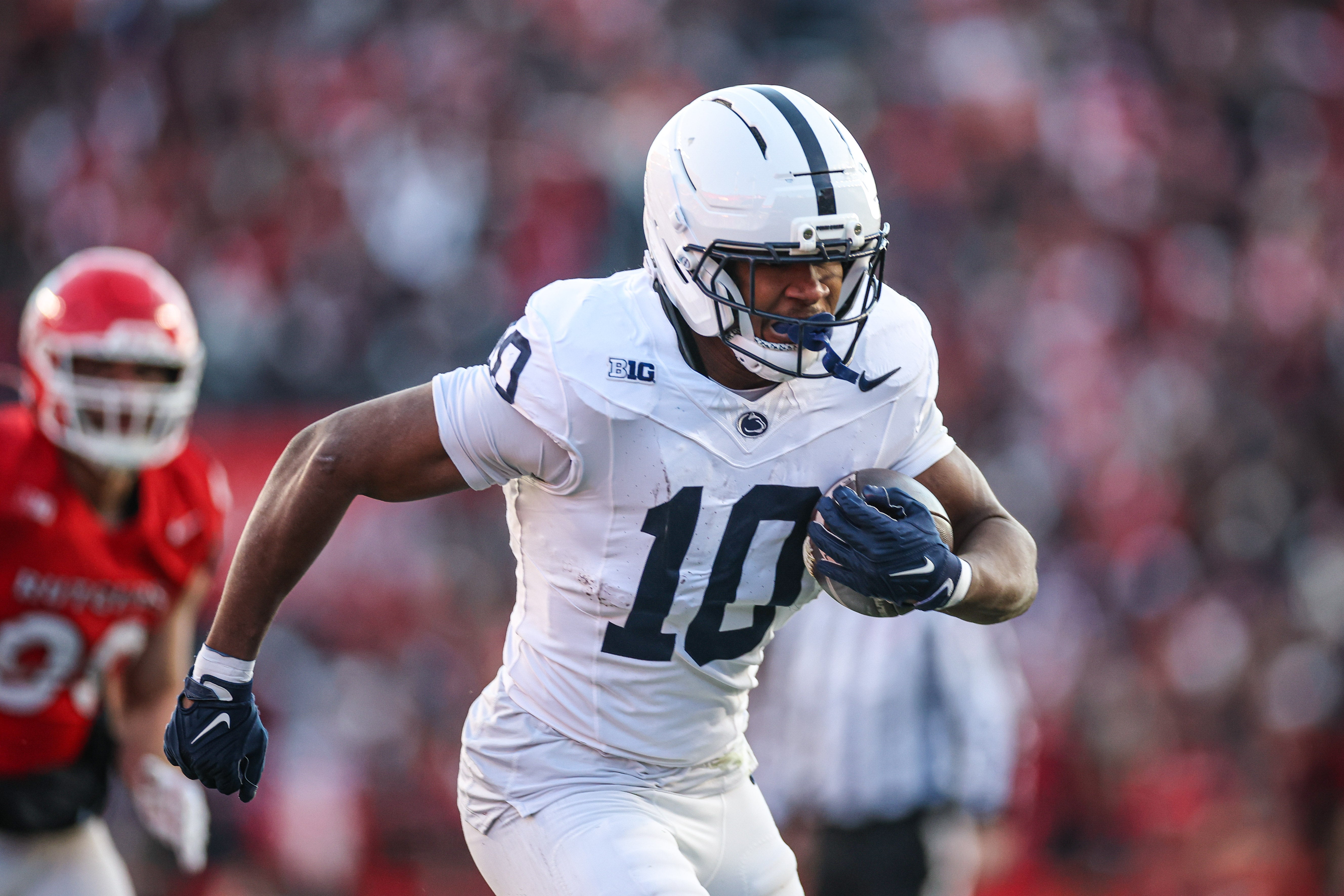Nov 29, 2025; Piscataway, New Jersey, USA; Penn State Nittany Lions running back Nicholas Singleton (10) carries the ball against the Rutgers Scarlet Knights during the first half at SHI Stadium.