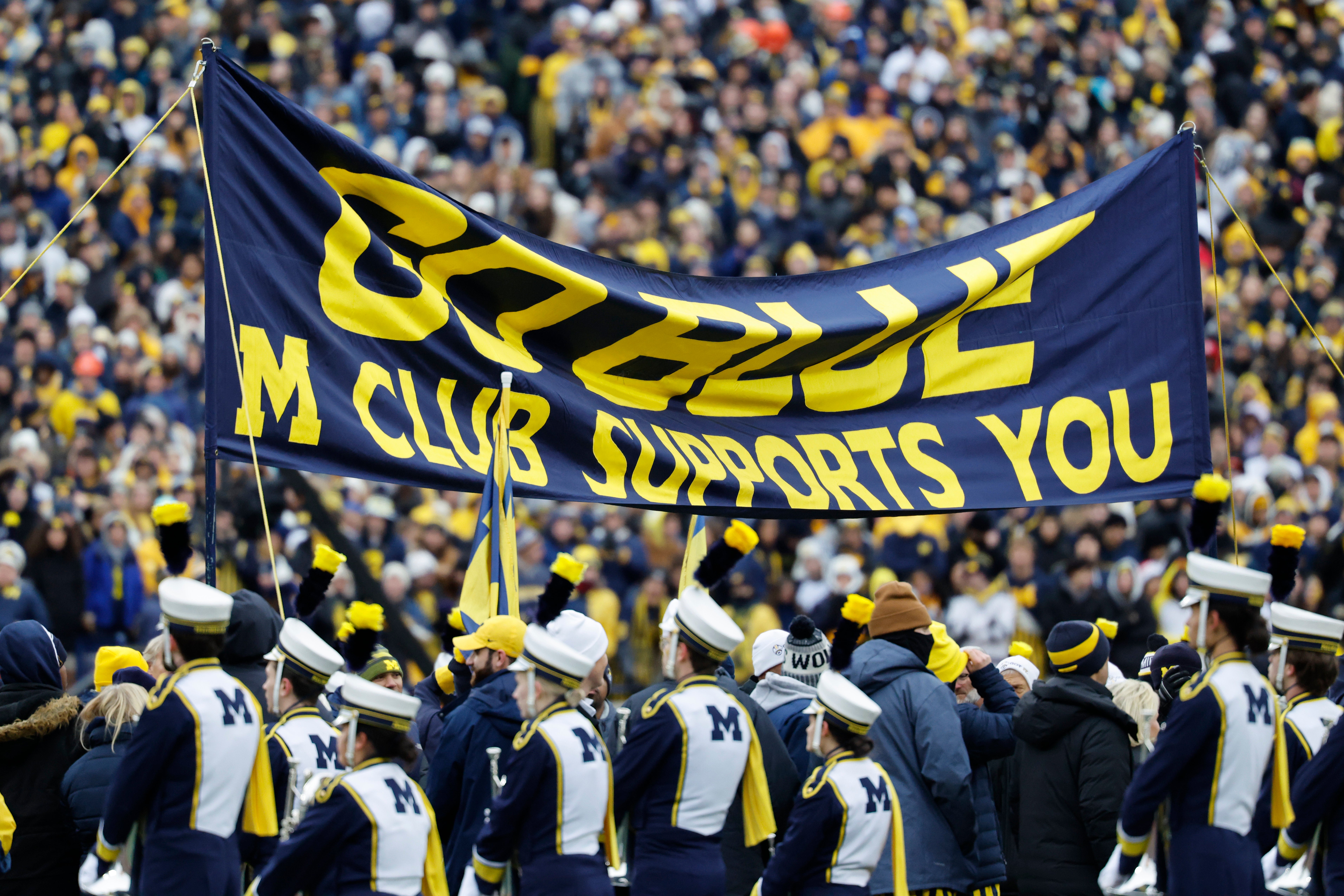 Nov 29, 2025; Ann Arbor, Michigan, USA; General view the Michigan Wolverines band signs before the game against the Ohio State Buckeyes at Michigan Stadium.