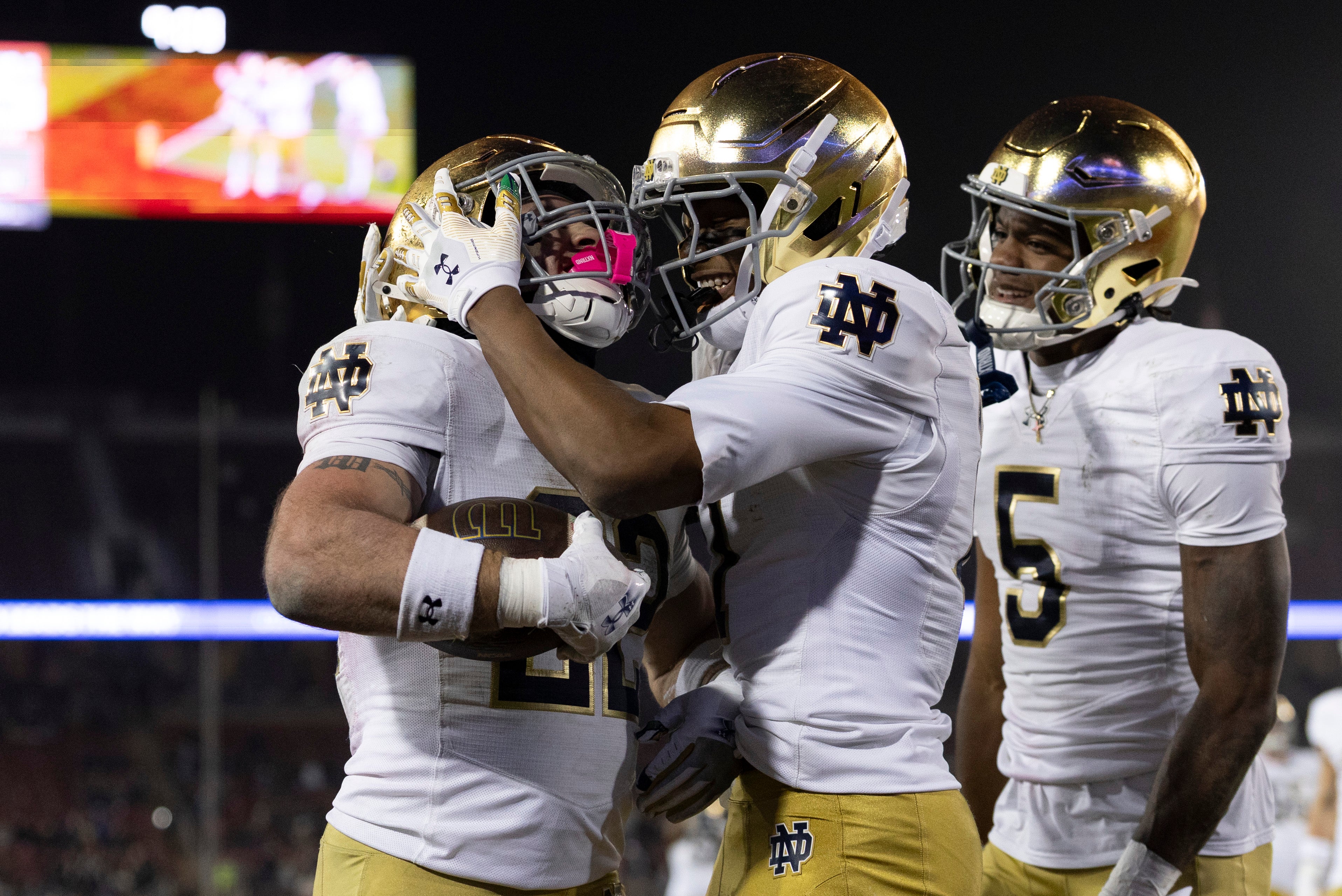 Nov 29, 2025; Stanford, California, USA; Notre Dame Fighting Irish running back Aneyas Williams (22) celebrates with Notre Dame Fighting Irish tight end Ty Washington (7) after scoring a touchdown during the fourth quarter against the Stanford Cardinal at Stanford Stadium. Mandatory Credit: Stan Szeto-Imagn Images