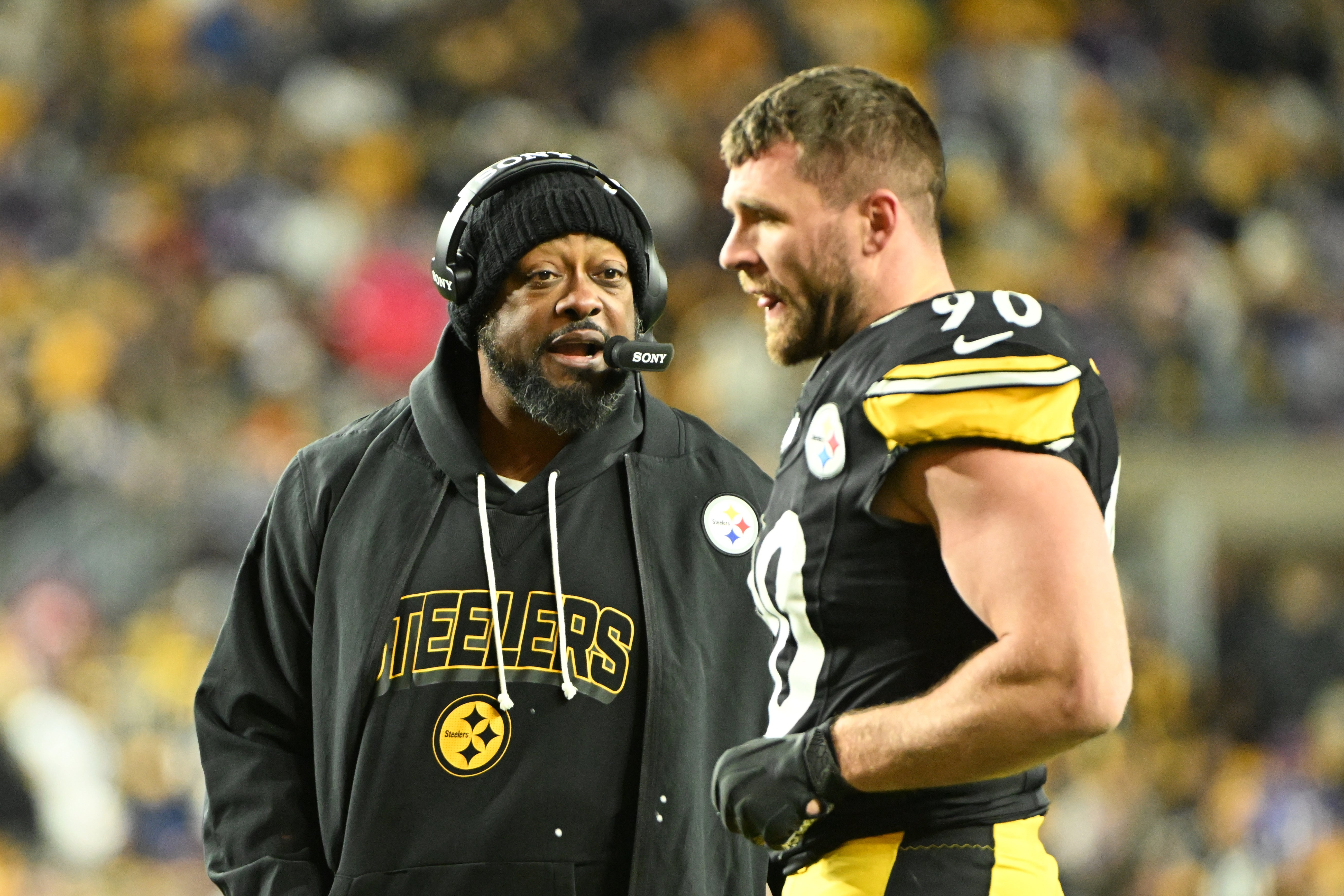 Nov 30, 2025; Pittsburgh, Pennsylvania, USA; Pittsburgh Steelers head coach Mike Tomlin speaks with Pittsburgh Steelers linebacker T.J. Watt (90) during the second quarter against the Buffalo Bills at Acrisure Stadium.