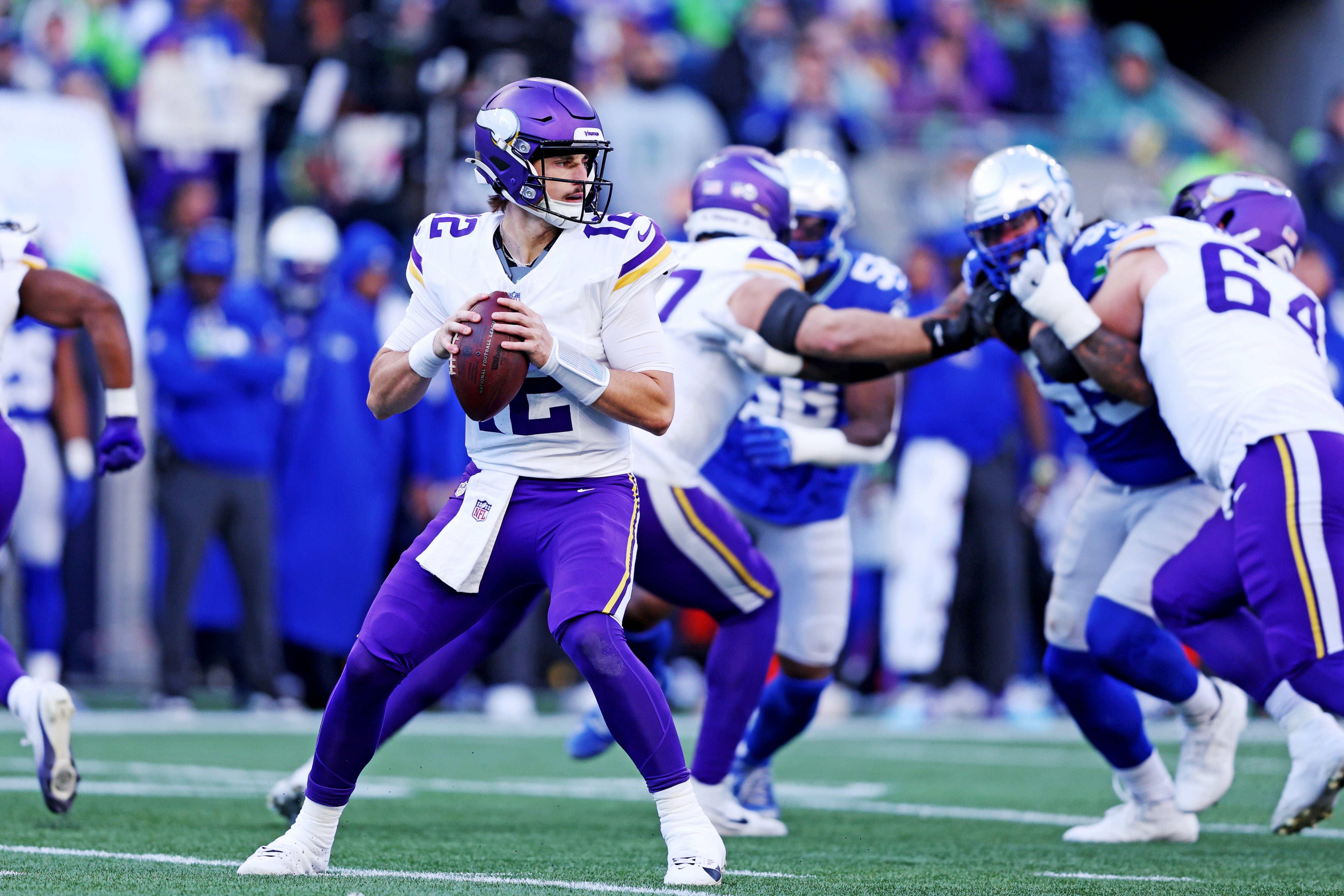 Nov 30, 2025; Seattle, Washington, USA; Minnesota Vikings quarterback Max Brosmer (12) drops back for a pass during the second half against the Seattle Seahawks at Lumen Field.