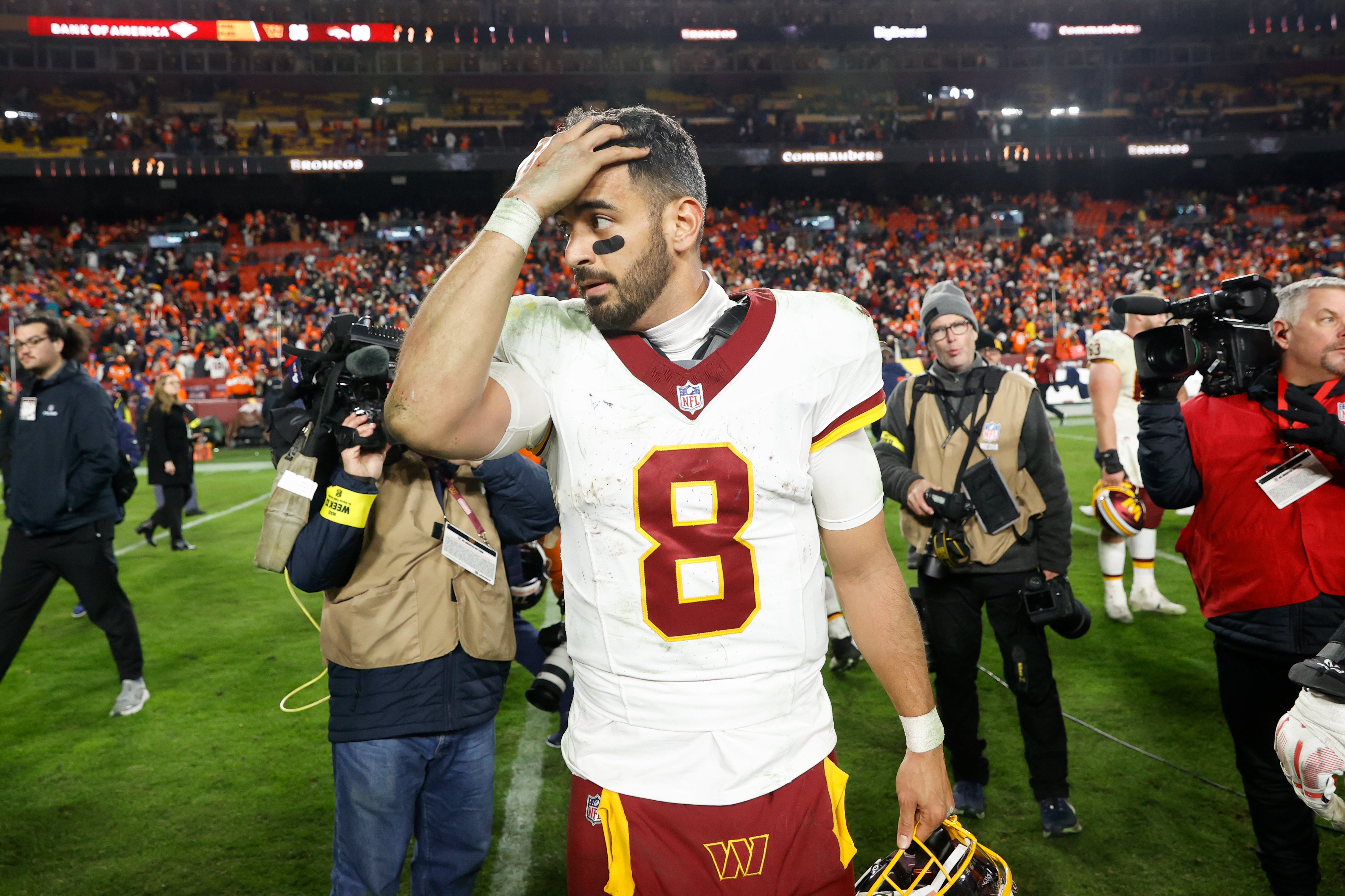 Nov 30, 2025; Landover, Maryland, USA; Washington Commanders quarterback Marcus Mariota (8) reacts after the game against the Denver Broncos at Northwest Stadium.