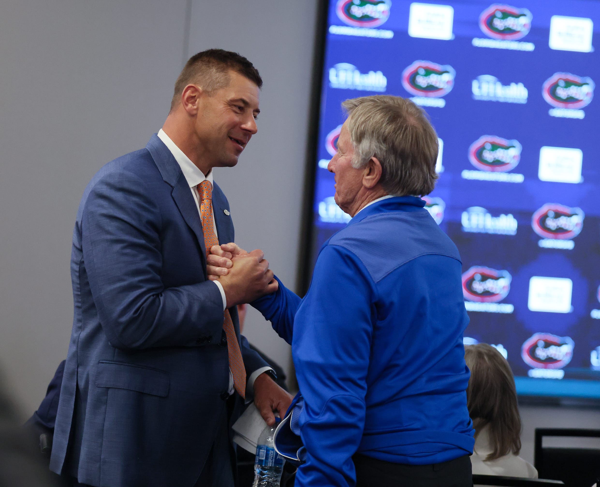 Coach legend Steve Spurrier, left, talks with new UF head football coach Jon Sumrall at the James W. “Bill” Heavener Football Training Center in Gainesville, FL on Monday, December 1, 2025. Alan Youngblood/Gainesville Sun