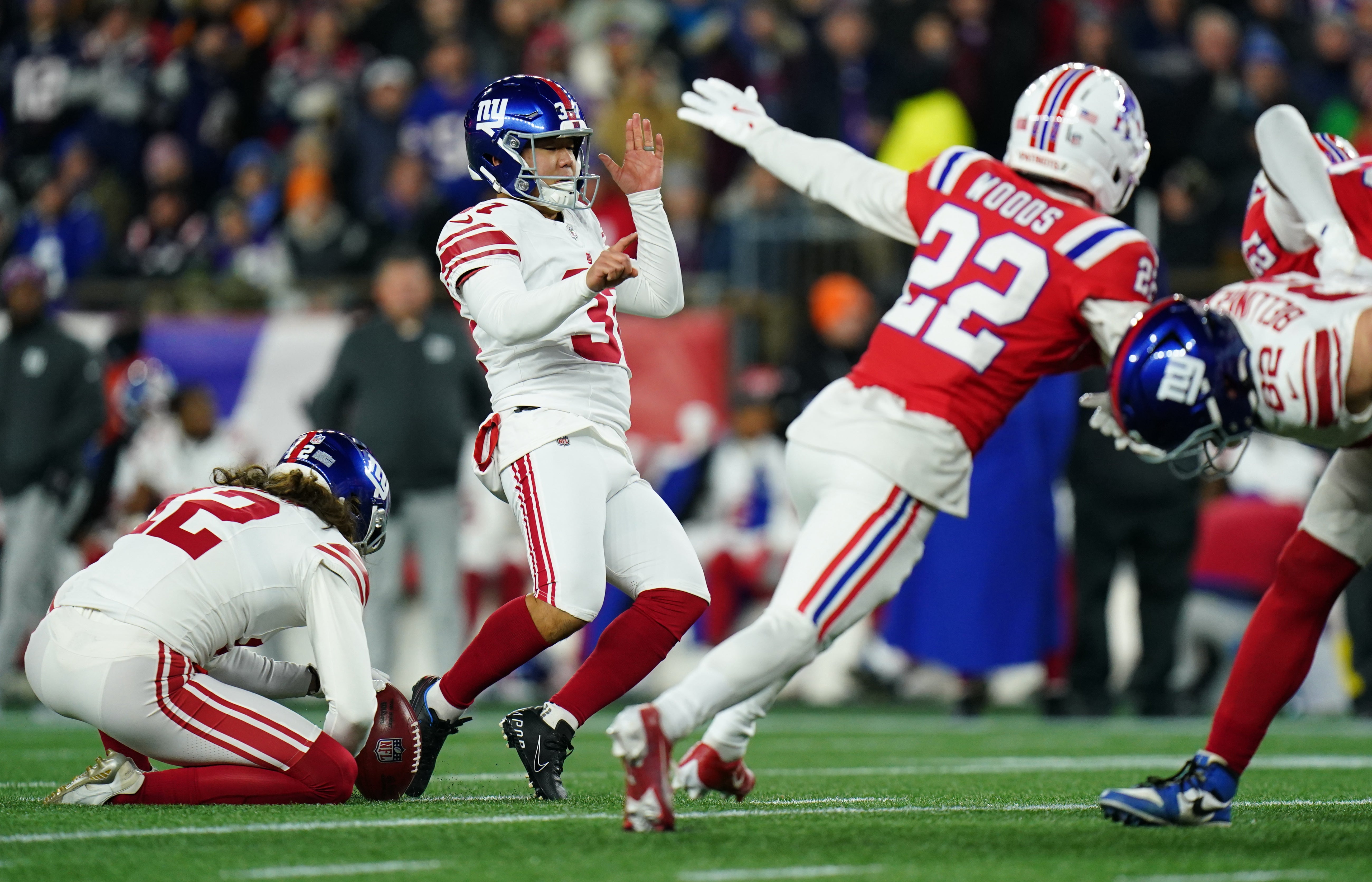 Dec 1, 2025; Foxborough, Massachusetts, USA; New York Giants place kicker Younghoe Koo (37) whiffs on a kick attempt during the second quarter against the New England Patriots at Gillette Stadium.