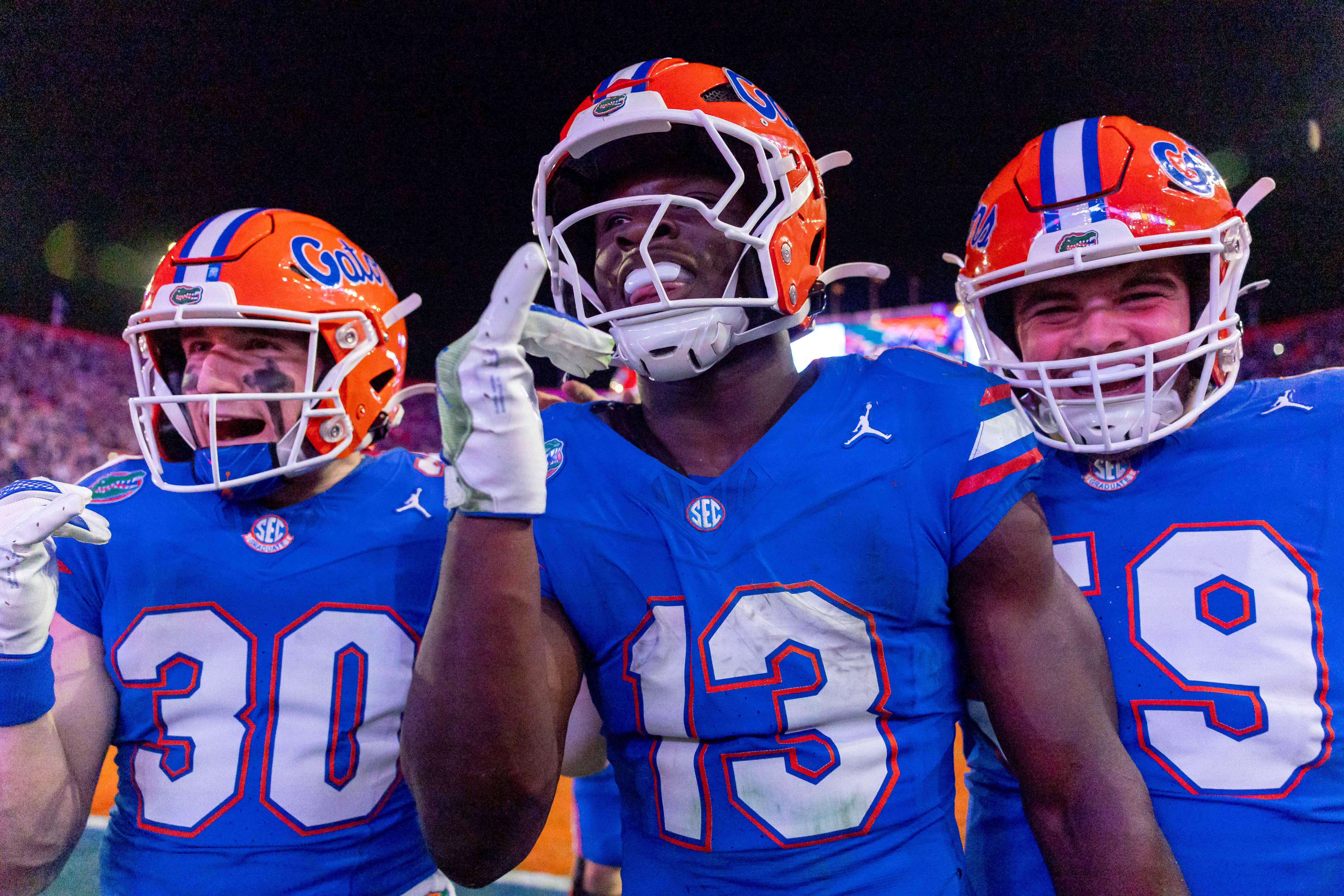 Nov 29, 2025; Gainesville, Florida, USA; Florida Gators running back Jadan Baugh (13) celebrates his touchdown during the fourth quarter against the Florida State Seminoles at Ben Hill Griffin Stadium.