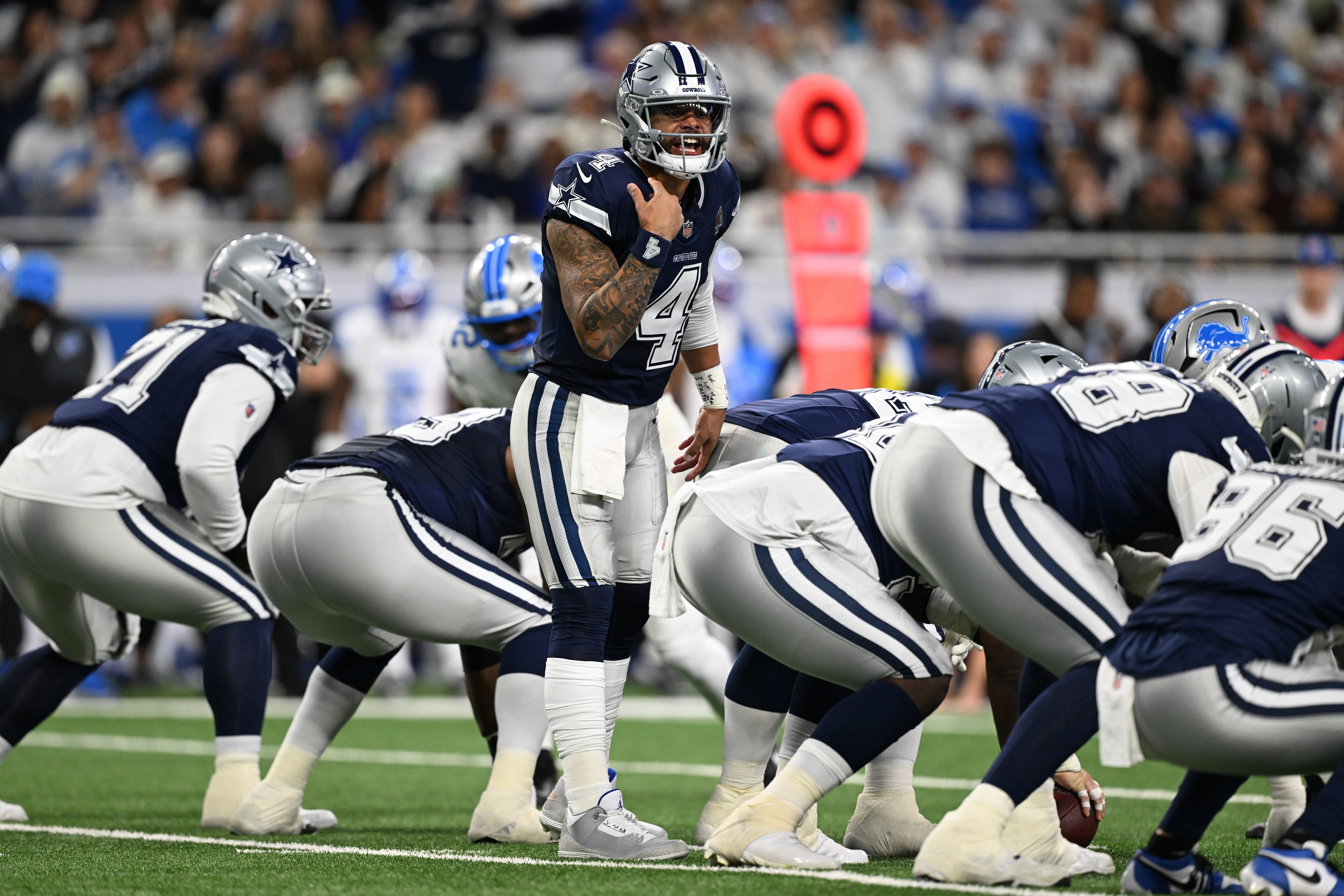Dec 4, 2025; Detroit, Michigan, USA; Dallas Cowboys quarterback Dak Prescott (4) audibles during the first half against the Detroit Lions at Ford Field.