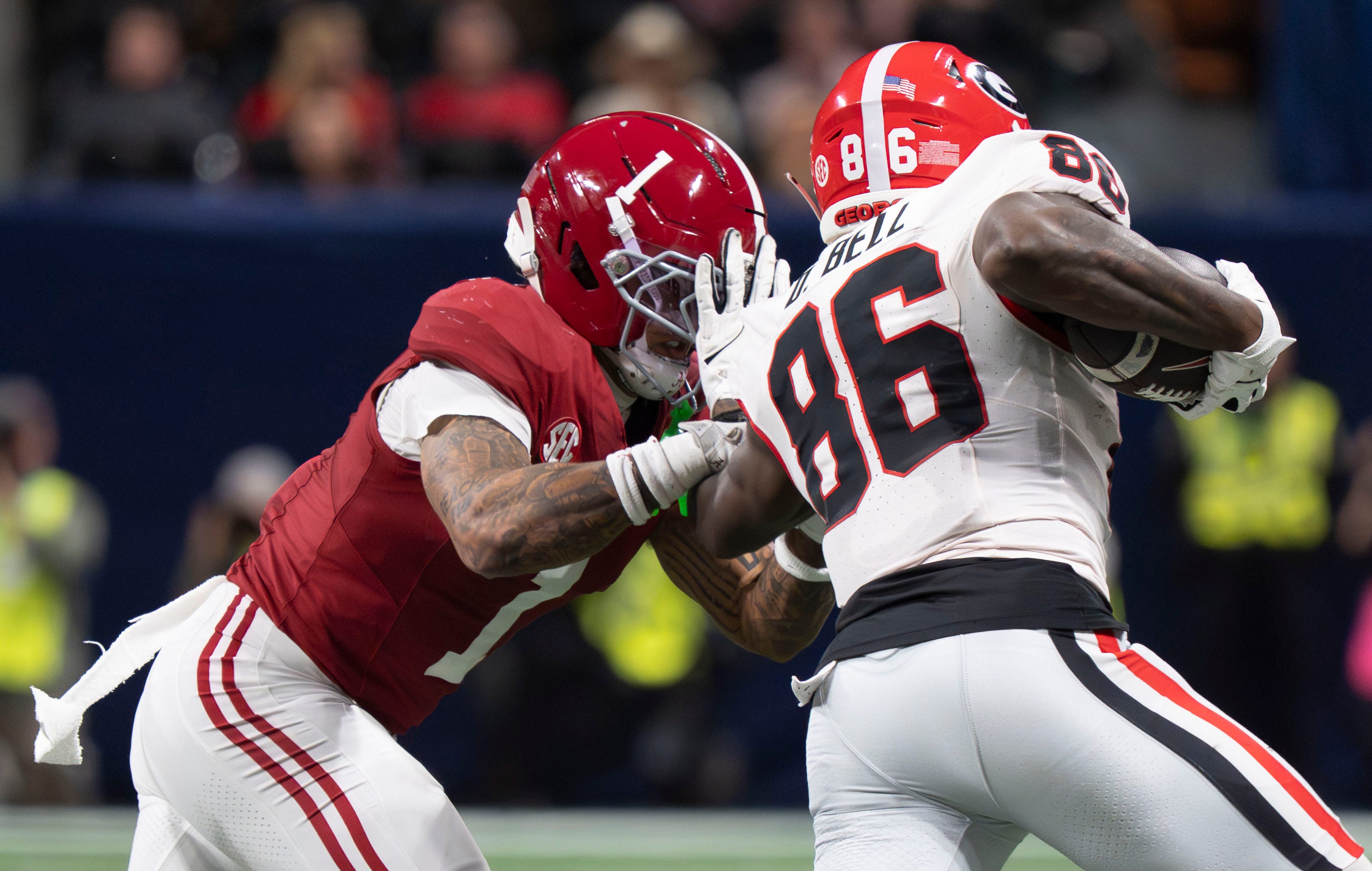 Dec 6, 2025; Atlanta, GA, USA; Alabama defensive back Domani Jackson (1) closes to make a tackle on Georgia wide receiver Dillon Bell (86) at Mercedes-Benz Stadium.