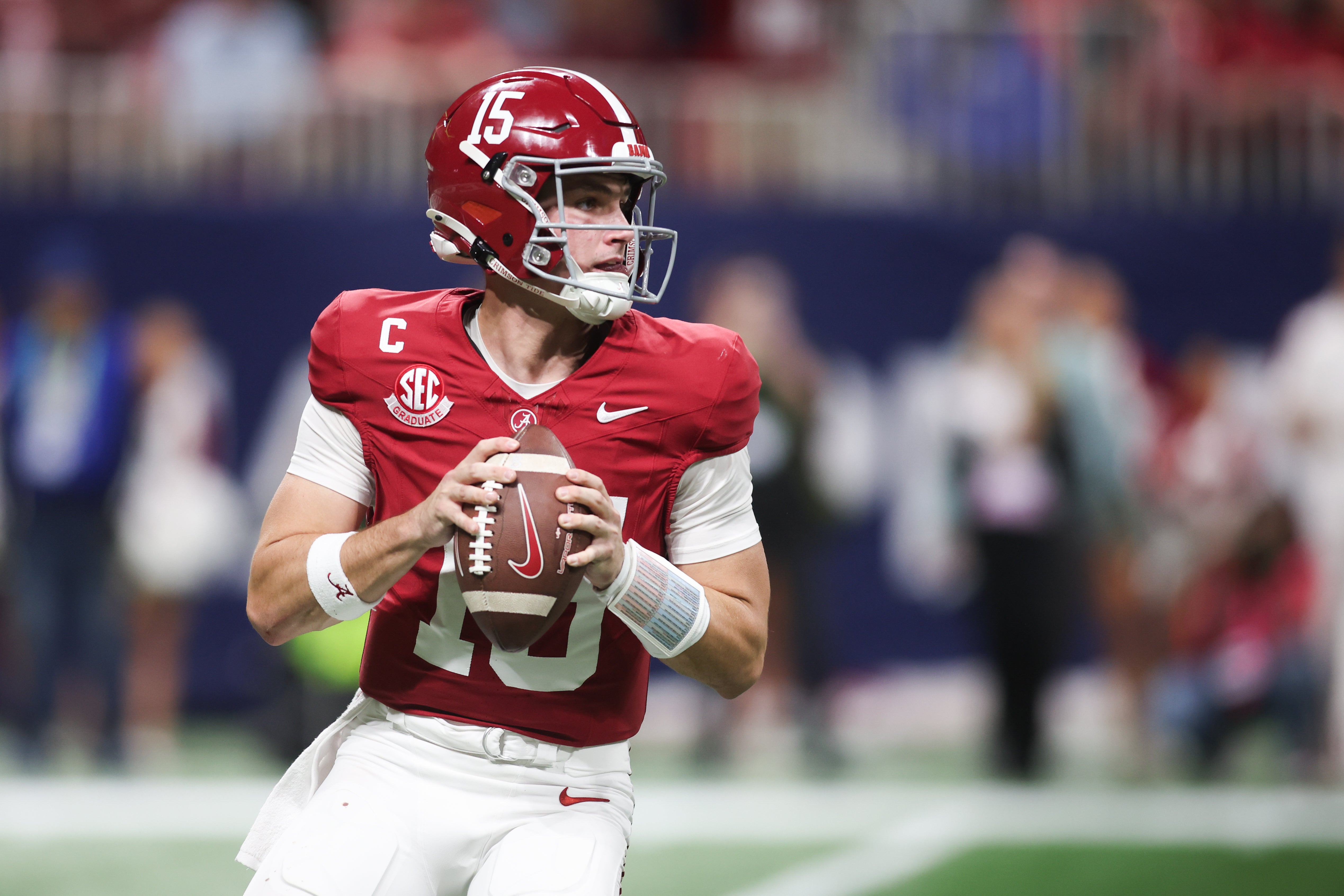 Dec 6, 2025; Atlanta, GA, USA; Alabama Crimson Tide quarterback Ty Simpson (15) looks to pass during the fourth quarter against the Georgia Bulldogs during the 2025 SEC Championship game at Mercedes-Benz Stadium.